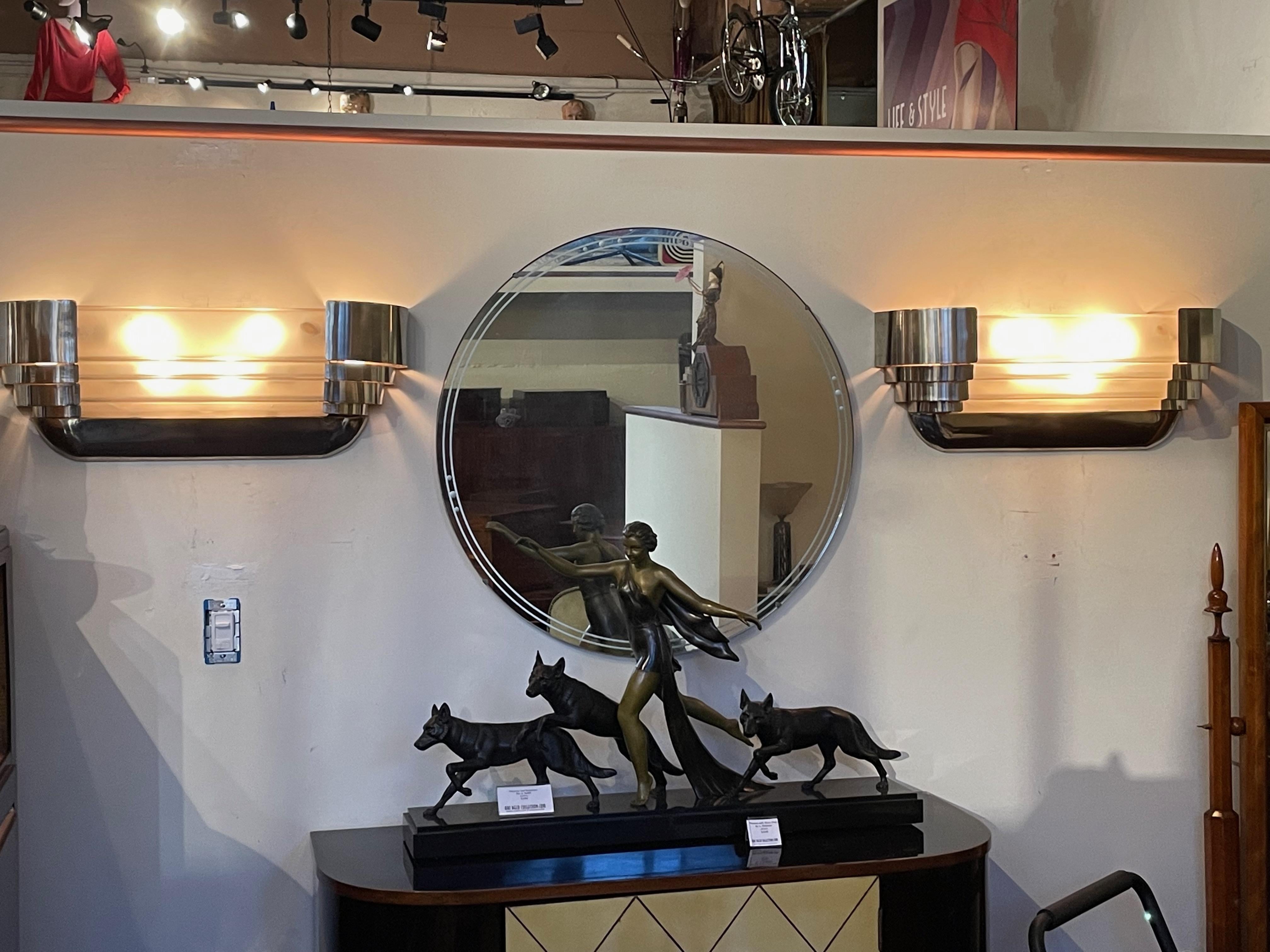 Sabino Art Deco Modernist Stepped Original chrome Sconces circa the 1930s. Rare pair of frosted Sabino glass sconces with unusual stepped metal treatment has mirrored echo design in the metalwork both in the forward design and the outside ribbed