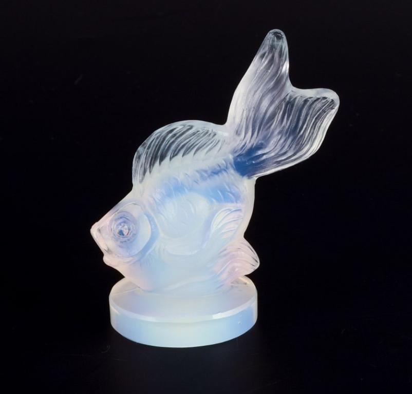 Sabino, France. A fish in Art Deco opaline art glass with a bluish tint. 
Approximately from the 1930s.
In good condition, with a small nick and a slightly larger chip on the base.
Stamped: Sabino, France.
Dimensions: D 5.0 cm x H 6.0 cm.