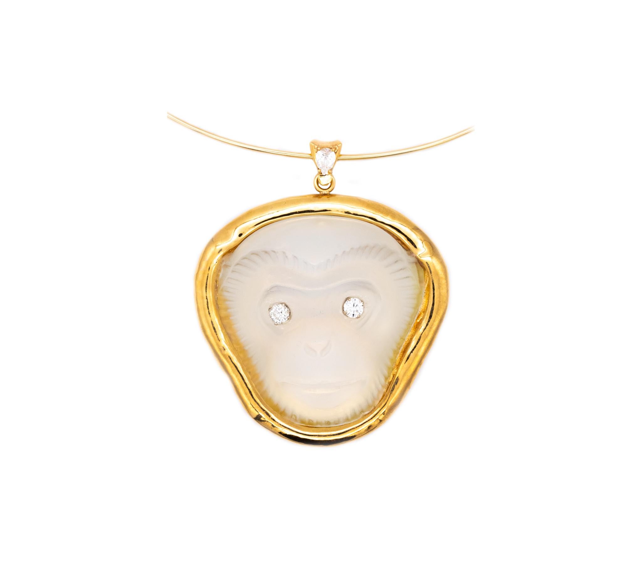 Massive Monkey pendant designed by Sabino.

A highly impressive statement piece of a three-dimensional monkey face, mounted in a free form frame, crafted in solid 18 karats of polished yellow gold with white gold accents for the settings of the