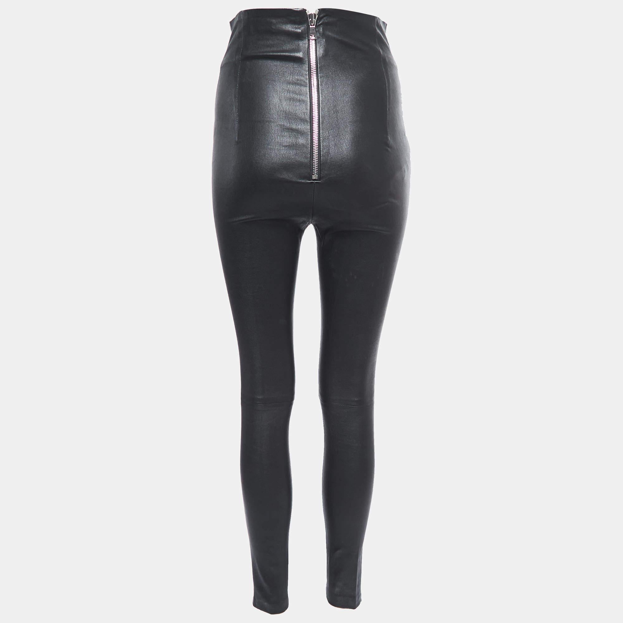 Sablyn's skinny leggings exude timeless allure and modern edge. Crafted from supple black leather, these leggings effortlessly contour to your figure, enhancing your silhouette. The sleek, form-fitting design is complemented by meticulous stitching,