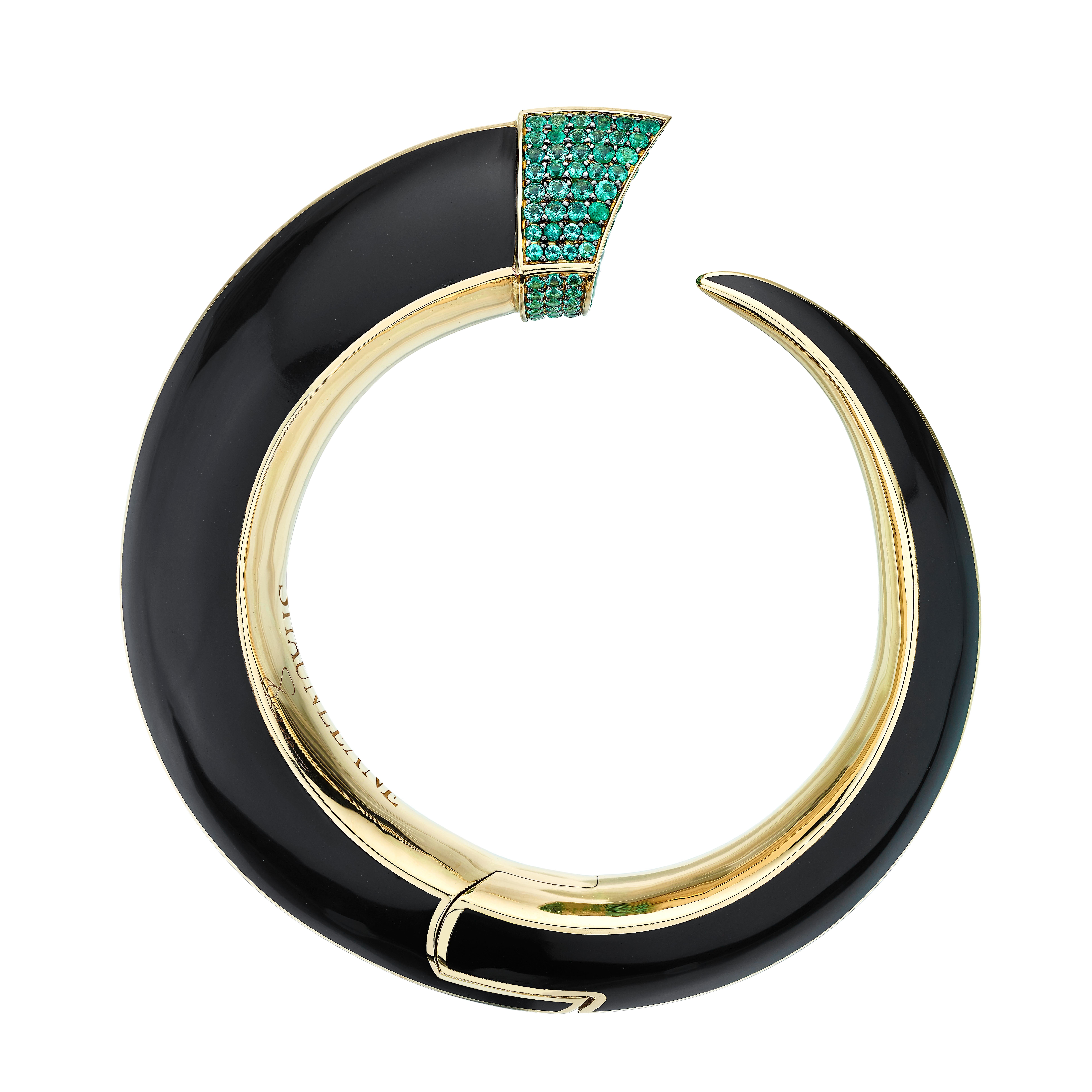 Leane's Sabre Couture Cuff is arguably his piéce de résistance; 18 carat gold inlaid with black ceramic, finished with 3.0 carats of precision-set emeralds. Here are two of Leane’s enduring influences: line, in the Sabre silhouette, and rigorous