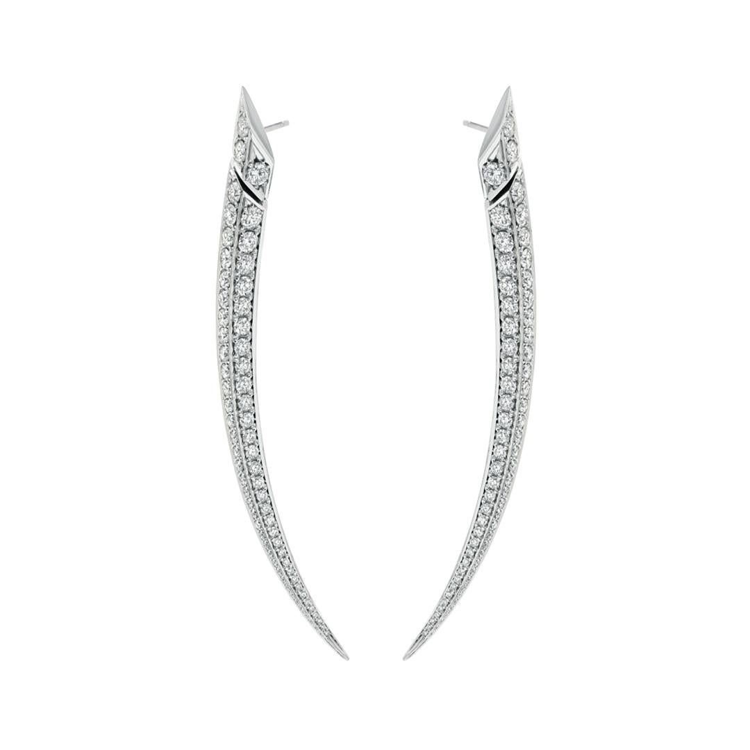 Crafted from 18ct white gold and a show stopping 6.64cts of brilliant white diamonds, Sabre Fine Large Earrings combine virtuosity with renowned House of Shaun Leane glamour. The Sabre silhouette is an elegant yet dangerous curve, and one of our