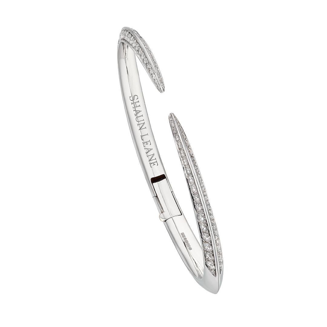 Sabre Fine Slim Bangle is handcrafted from 18ct white gold and 1.93cts of brilliant white diamonds. The eye is in the details; perfect proportions, the weight of the pieces on your skin, their movement on your body. The Sabre silhouette is an