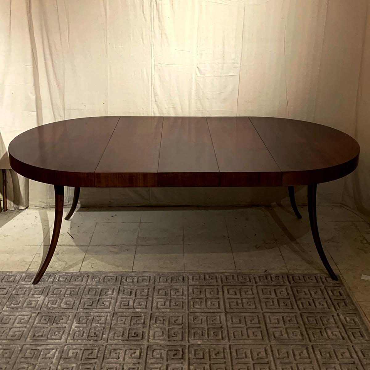 Elegant walnut round dining or center table that has 3 leaves which can be used individually or together for 3 different sized oval dining table options. This table has been fully restored by one of Columbia County's best furniture restorers and