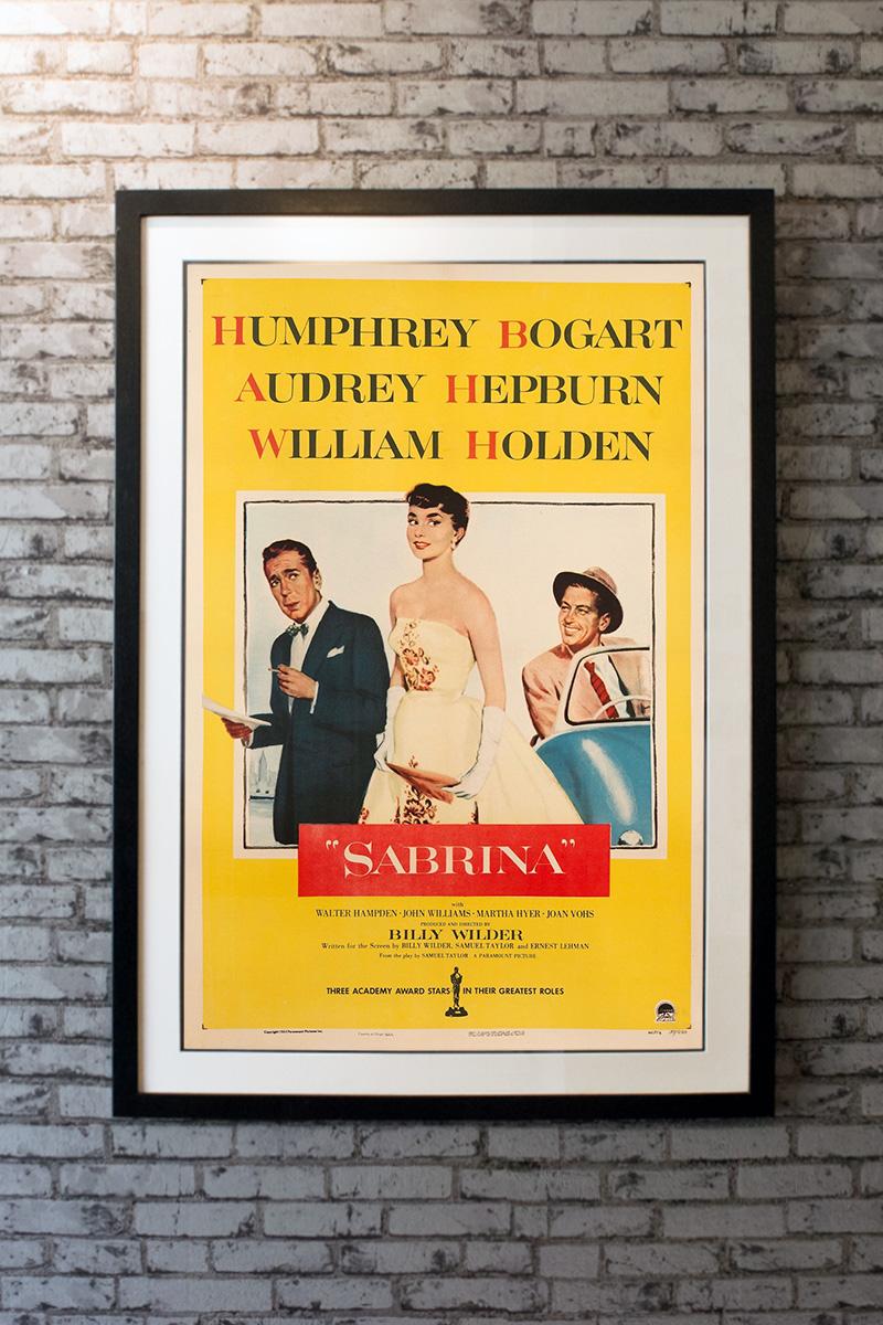 Chauffeur's daughter Sabrina (Audrey Hepburn) returns home from two years in Paris a beautiful young woman, and immediately catches the attention of David (William Holden), the playboy son of her father's rich employers. David woos and wins Sabrina,