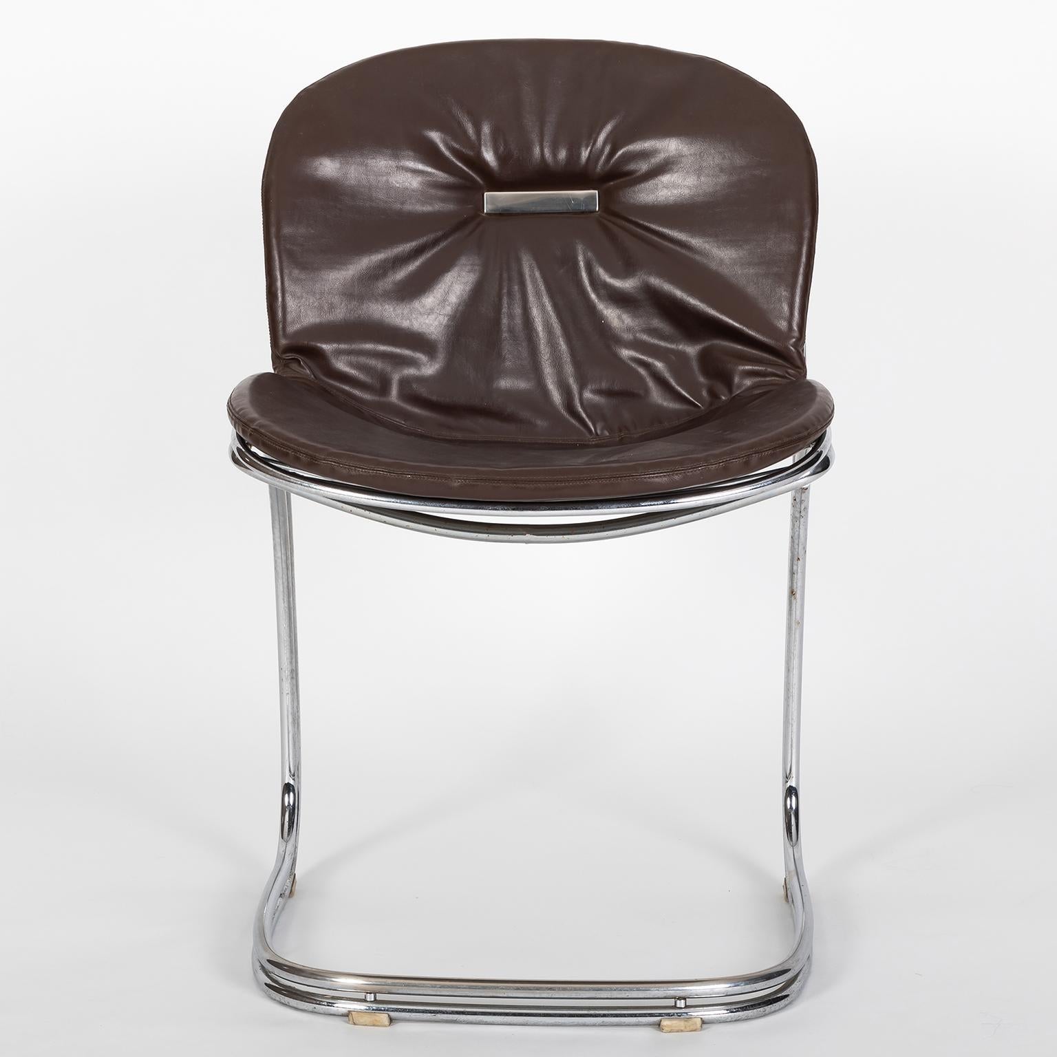 Sabrina Chair designed for RIMA by Gastone Rinaldi with original uphosltery in chocolate brown leather.

Gastone Rinaldi was born in Padua on 16 November 1920. In 1916 his father Mario had established RIMA, a company for the production of metal