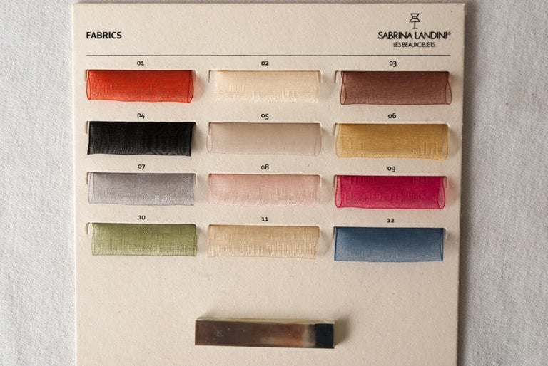 Sabrina Landini's sample dashboard is complete with:
-selection of hand-painted silk or gauze colors 
-metallic finishes
-silver glass plate  
 