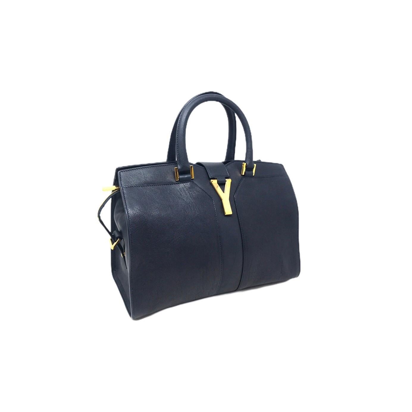 Saint Laurent Sac bag in dark blue leather with golden metal Y logo detail, like new condition
dimensions: 30 x 22 cm 
Complete with removable shoulder strap