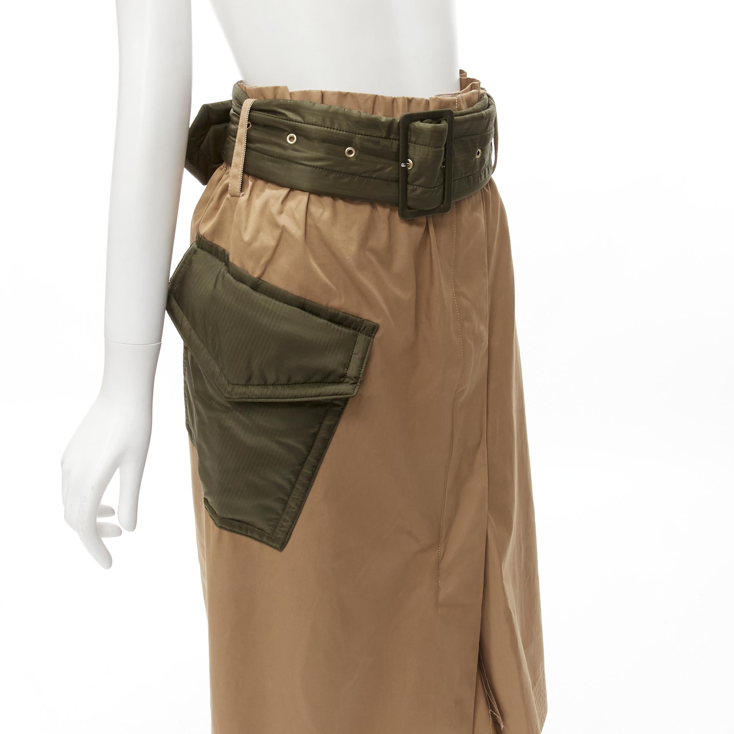 SACAI 2019 khaki brown semi detached hem padded nylon pocket belted skirt JP2 M
Brand: Sacai
Designer: Chitose Abe
Collection: 2019 
Material: Cotton
Color: Tan Brown
Pattern: Solid
Closure: Zip
Extra Detail: Paperbag waist. Concealed heavy duty zip