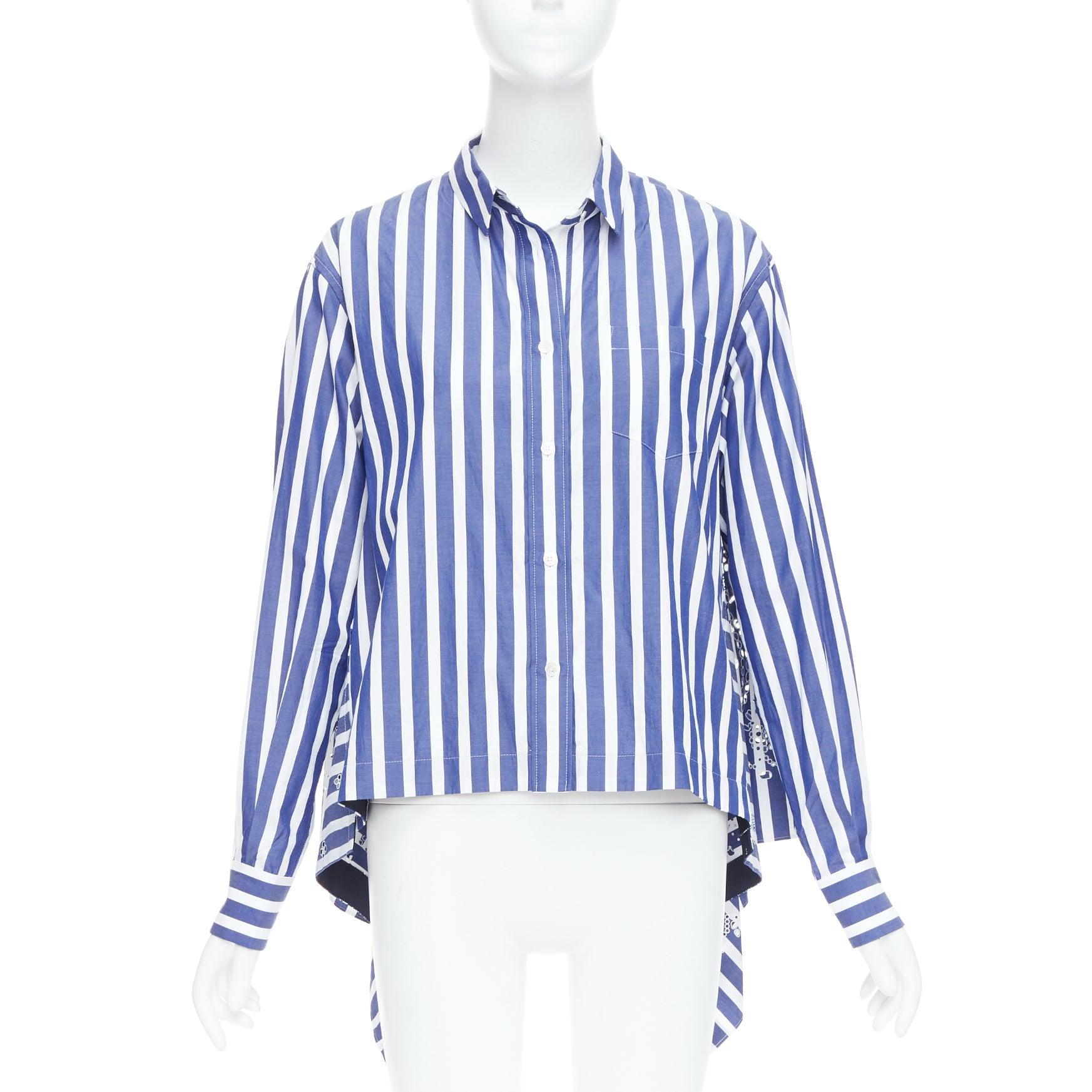 SACAI 2021 blue white striped eyelet flared back dress shirt JP3 L
Reference: KNLM/A00404
Brand: Sacai
Designer: Chitose Abe
Collection: 2021
Material: Cotton
Color: Blue, White
Pattern: Striped
Closure: Button
Extra Details: Laser cut eyelets at