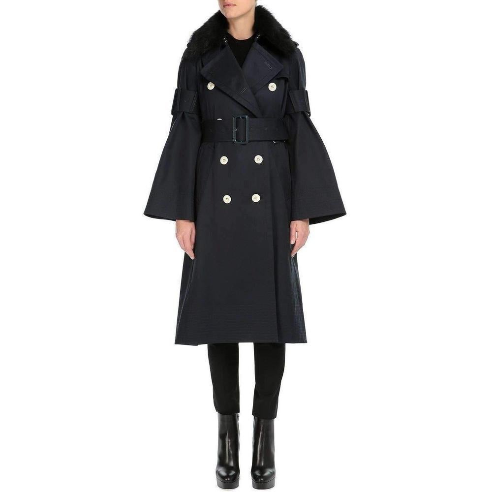 Double-breasted trench coat features buckle belt bell sleeves and a removable fur collar.
Button epaulettes.
Raglan sleeves.
Self-belt loops.
Angled welt front pockets.
Shoulder yoke and inverted pleat with button closure at back.
Hook-and-eye