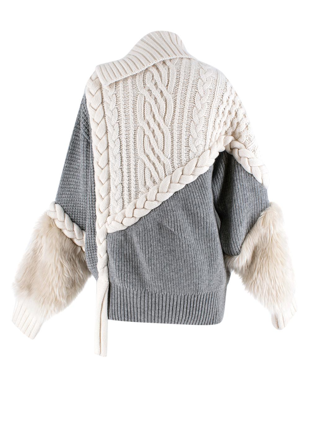 Sacai Grey Cable Knit Wool Faux Fur Cuff Zipped Jacket

- Wool cable knit detailing 
- False fur trim cuffs
- Ribbed high neck
- Exposed zip fastening at front
- Curved asymmetric hem 
- Contrast grey and cream panelling 
- Front silver metal