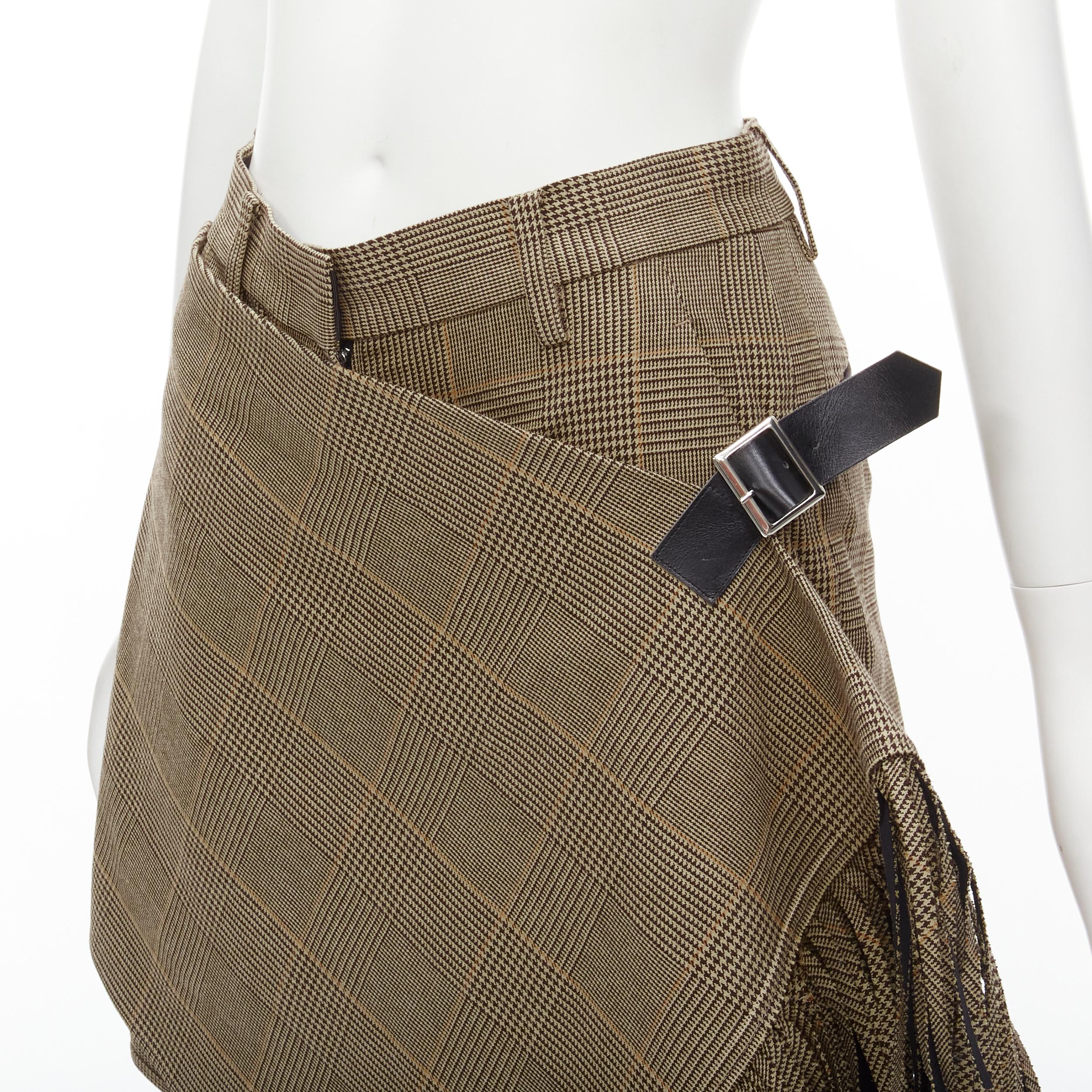 SACAI brown herringbone check fringe wrap front buckle shorts JP1 S 
Reference: ANWU/A00442 
Brand: Sacai 
Designer: Chitose ABe 
Material: Feels like cotton 
Color: Brown 
Pattern: Check 
Closure: Zip 
Extra Detail: Concealed zip fly. Wrap fringe