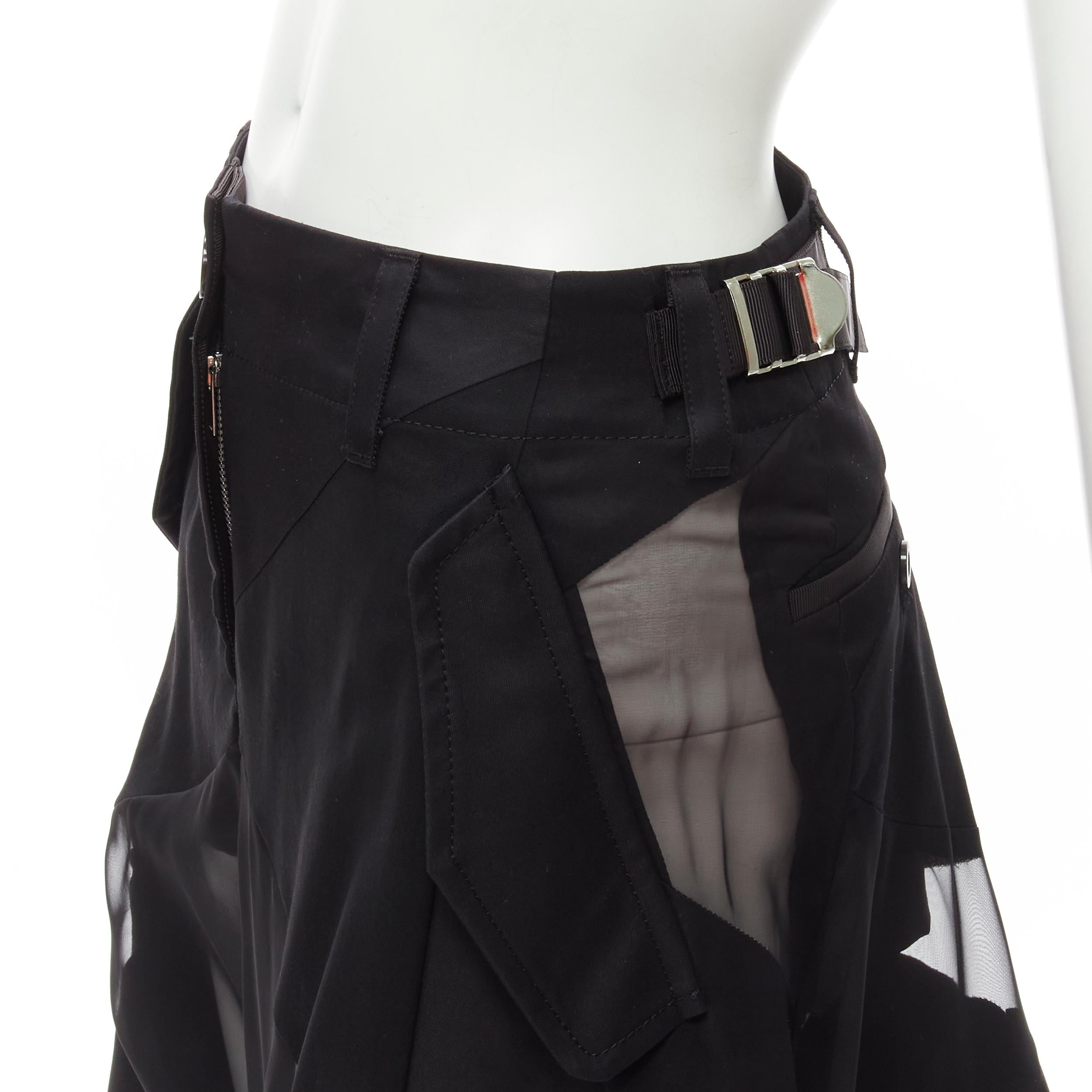 SACAI Chitose Abe black deconstructed sheer panel wide skirt flared shorts S
Brand: Sacai
Designer: Chitose Abe
Material: Feels like cotton
Color: Black
Pattern: Solid
Closure: Zip
Extra Detail: Mixed fabric patchwork design. Sheer panel. Utility