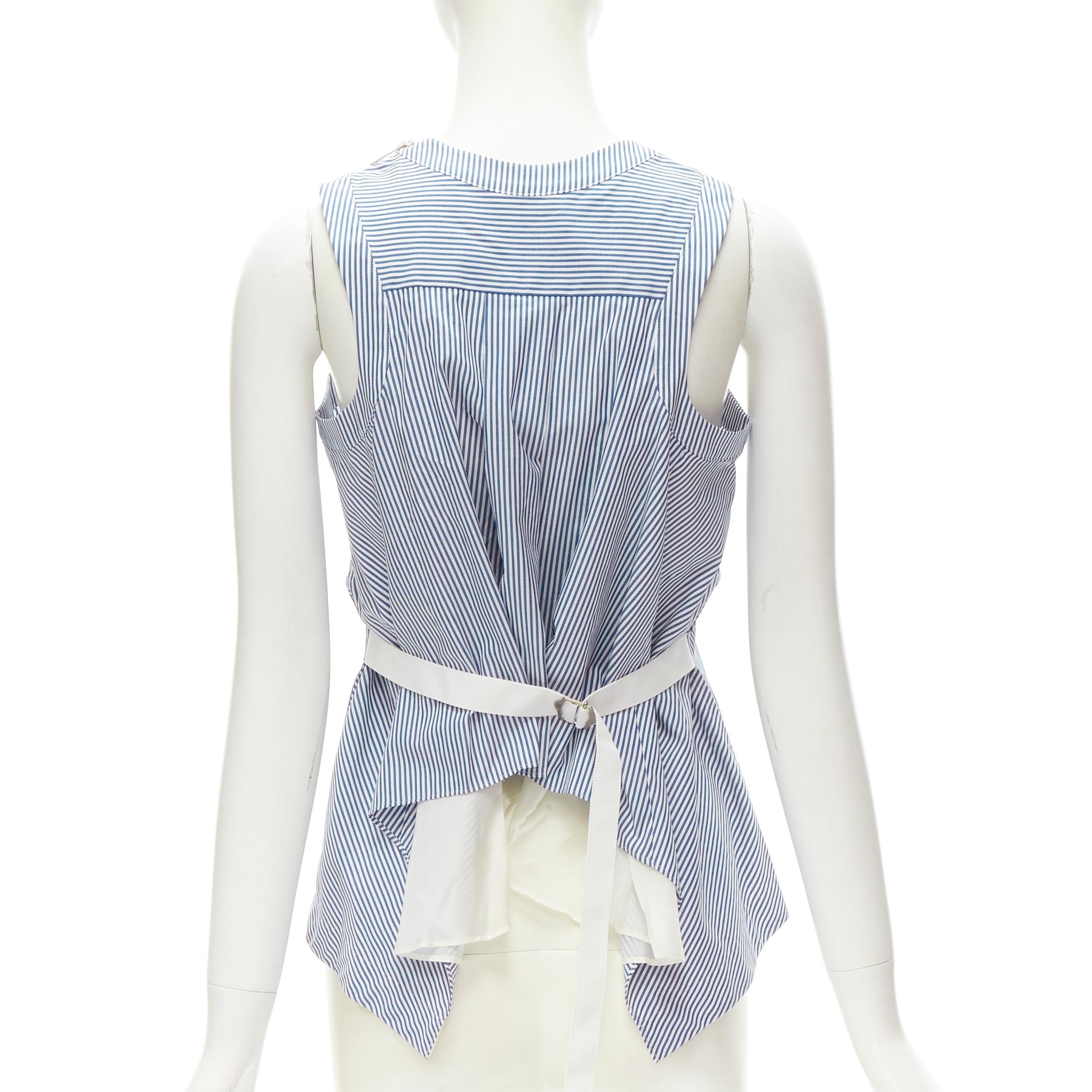 SACAI Chitose Abe blue striped cotton grosgrain belted layered back tank top S
Brand: Sacai
Designer: Chitose Abe
Material: Feels like cotton
Color: Blue
Pattern: Striped
Extra Detail: Grosgrain belted back. Curved cut at back exposing white