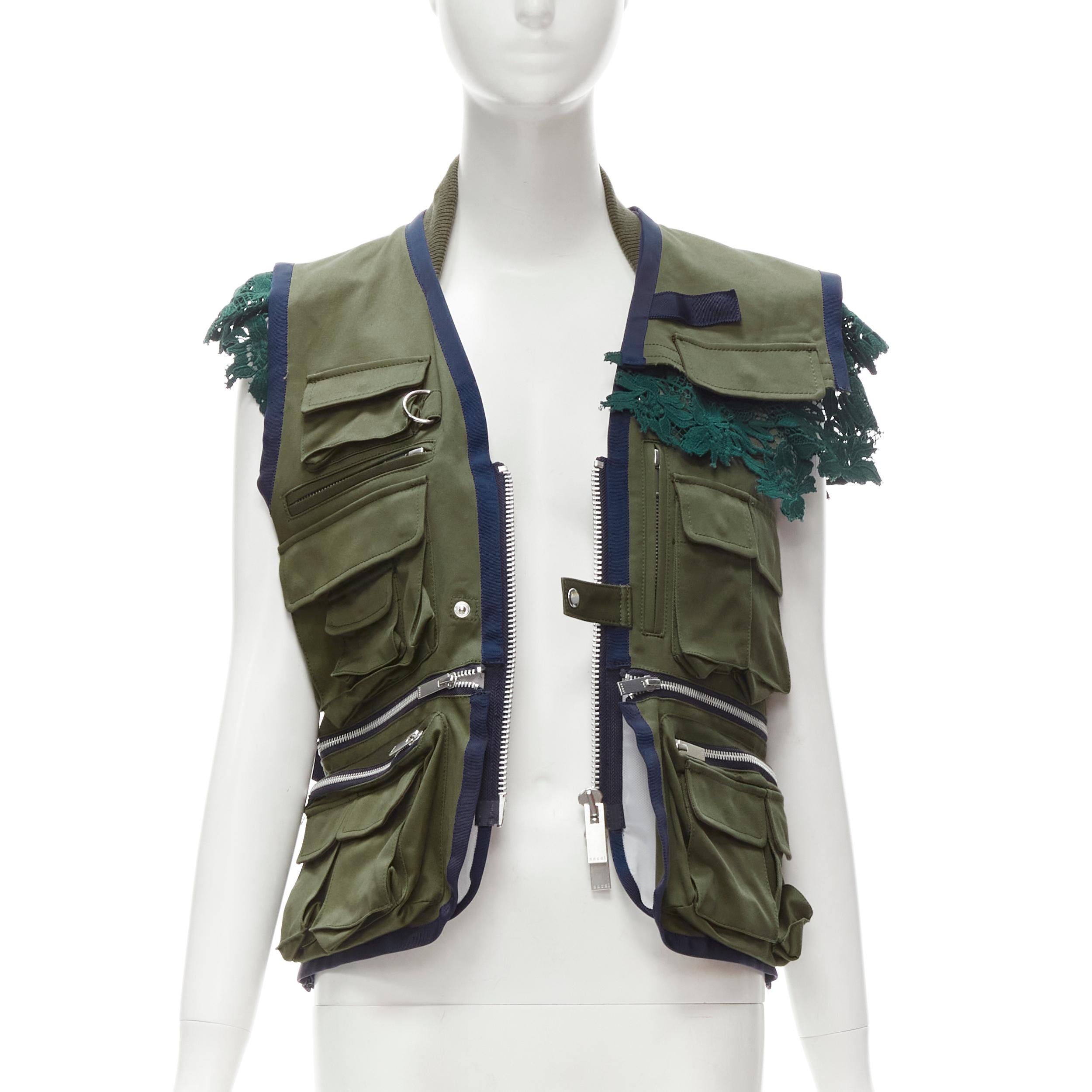 SACAI Chitose Abe green fisherman pocket ruffle lace trim vest jacket S
Brand: Sacai
Material: Feels like cotton
Color: Green
Pattern: Solid
Closure: Zip
Extra Detail: Green lace embroidery anglais trim. White mesh panel at back. Fisherman flap