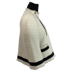 Chaqueta de tweed de Sacai con doble cremallera, de lana blanca