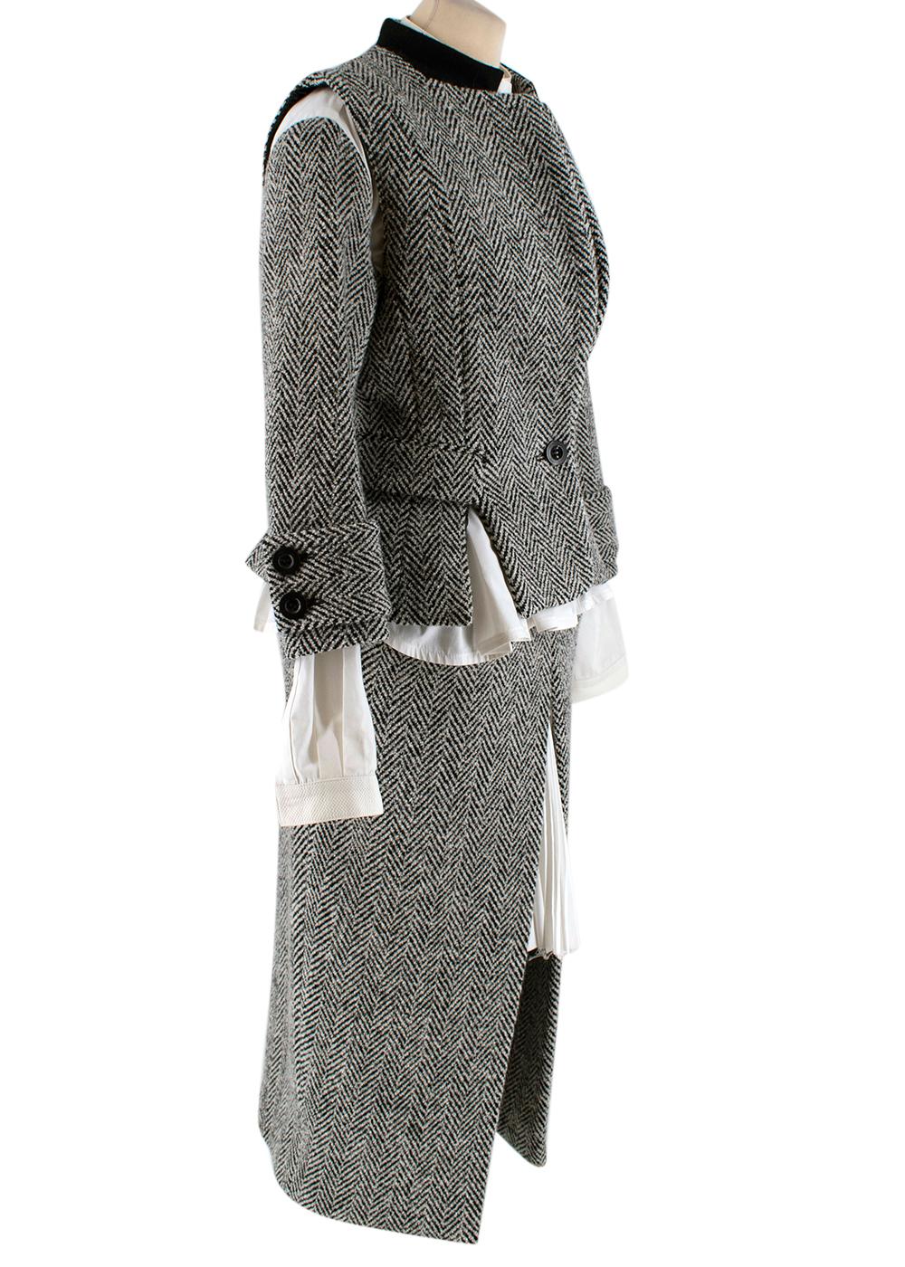 Sacai Grey Wool Chevron Tweed Layered Jacket & Skirt 

- Grey Tweed Wool long-sleeve jacket and midi length skirt
- Panelled contrast white shirt sewn into jacket 
- Peplem style 
- Single button fastening on jacket with front flap pockets, front
