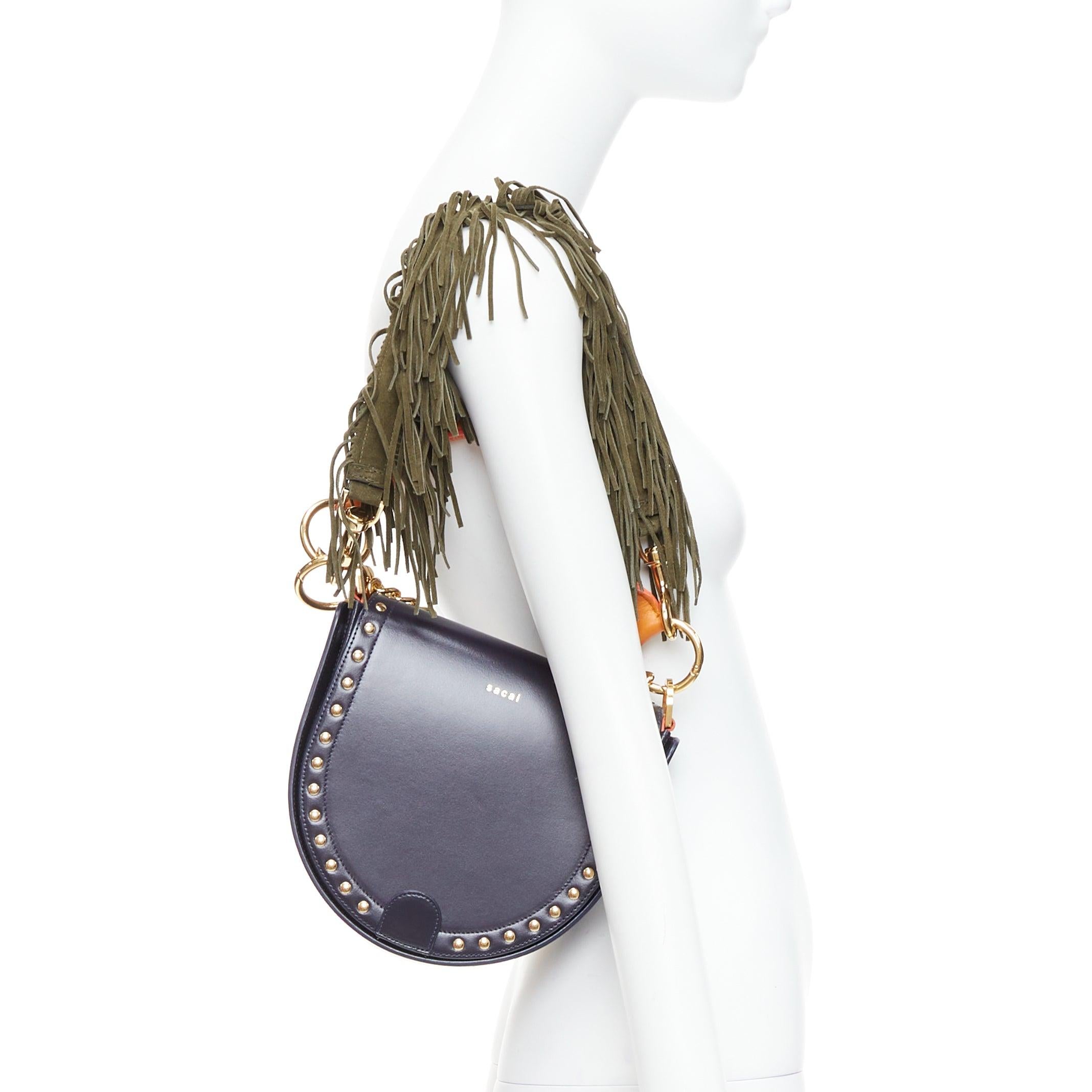 SACAI Horseshoe navy orange fringe leather colorblock saddle bag
Reference: LAYU/A00043
Brand: Sacai
Designer: Chitose Abe
Model: Horseshoe
Material: Leather
Color: Navy, Orange
Pattern: Solid
Lining: Navy Leather
Extra Details: Interchangeable