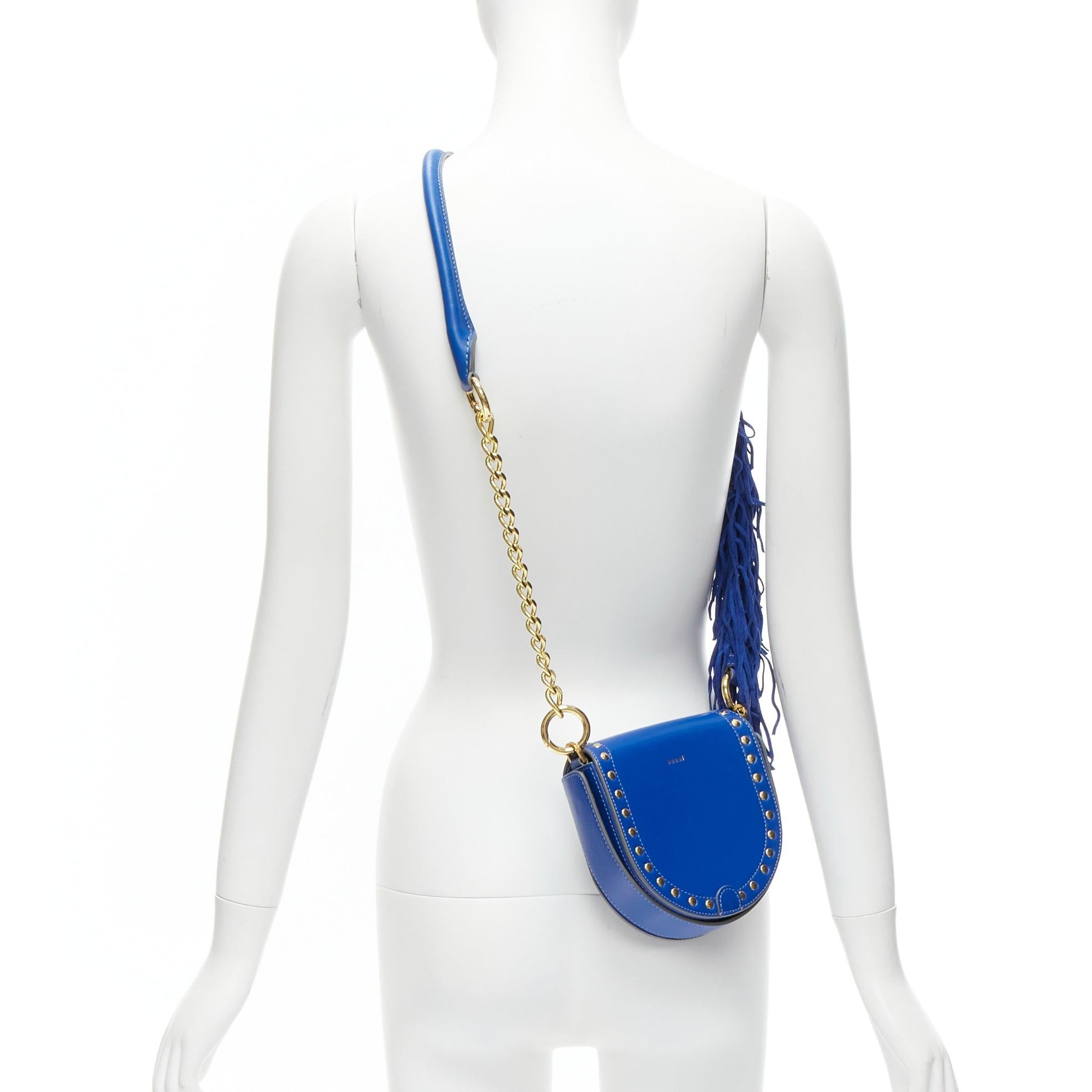 SACAI Horseshow cobalt blue leather suede fringe studs crossbody bag
Reference: BSHW/A00072
Brand: Sacai
Designer: Chitose Abe
Model: Horseshoe
Material: Leather
Color: Blue, Gold
Pattern: Solid
Lining: Blue Leather
Extra Details: Interchangeable