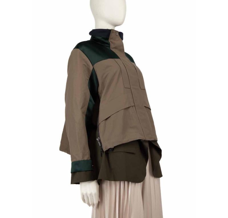 CONDITION is Very good. Hardly any visible wear to the jacket is evident on this used Sacai designer resale item.
 
 
 
 Details
 
 
 Khaki
 
 Cotton
 
 Parka jacket
 
 Green tone colour blocked detail
 
 Zip and snap button fastening
 
 Mid length
