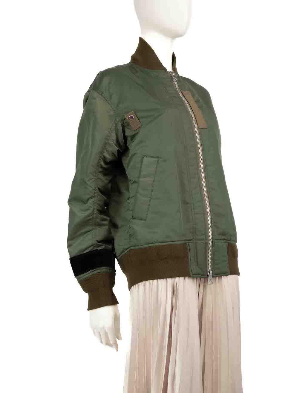 CONDITION is Very good. Minimal wear to bomber jacket is evident. Minimal wear to the front with some small water marks, light pilling to the bottom edge and some loose threads can be seen on the bottom left sleeve on this used Sacai designer resale