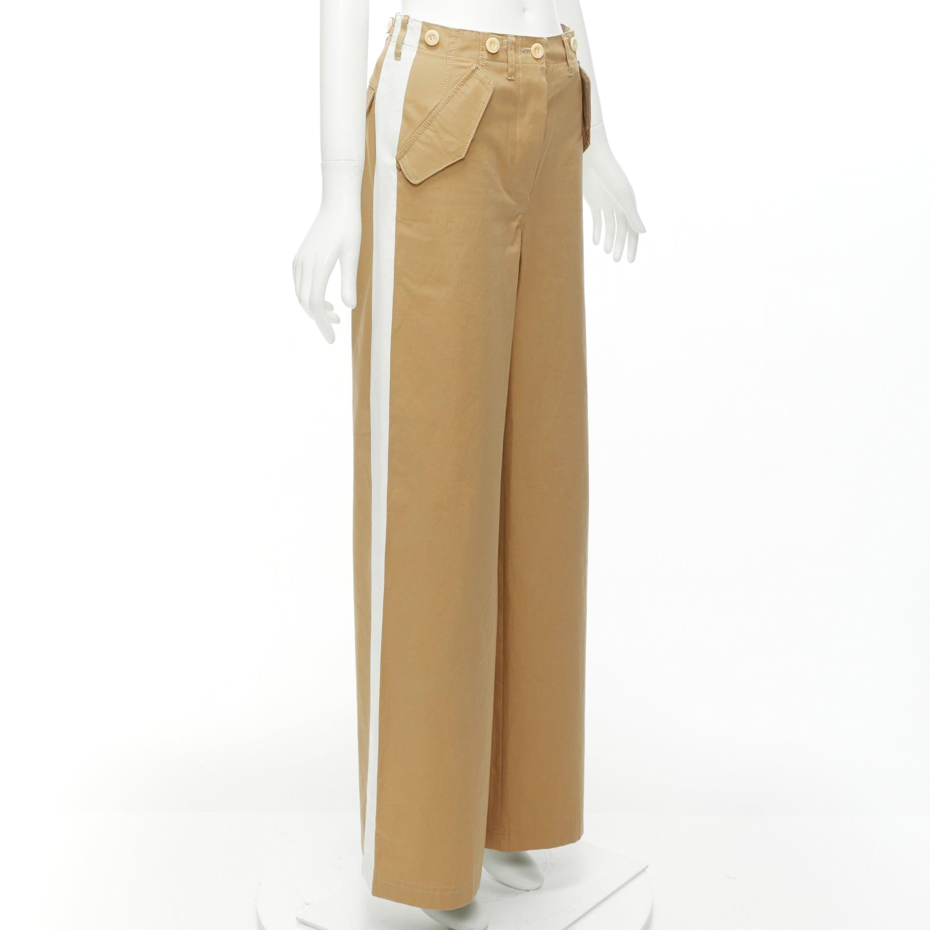 SACAI LUCK beige off white button embellished waistband wide cargo pants
Reference: NKLL/A00191
Brand: Sacai
Designer: Chitose Abe
Collection: LUCK
Material: Feels like cotton
Color: Beige, Off White
Pattern: Solid
Closure: Button Fly
Lining: Beige