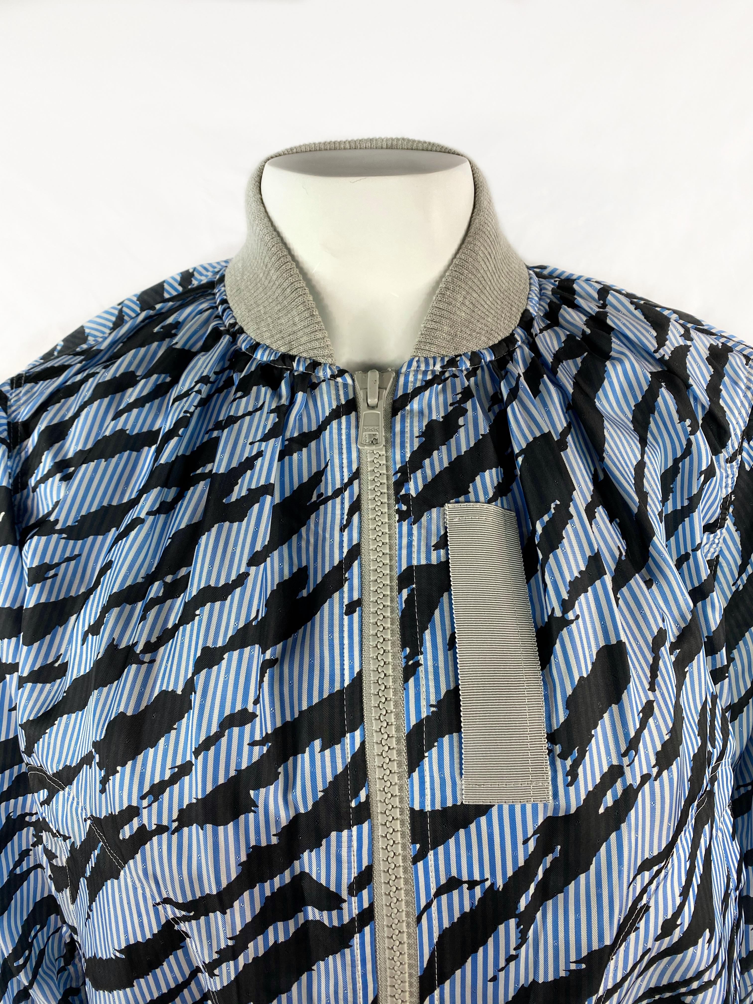 Sacai Luck Light Blue Zebra Striped Bomber Jacket Size 2

Product details:
BRAND NEW, never worn, with tags attached 
Size US2
Light blue, black and grey
Striped zebra print 
Front grey zipper closure
Featuring one open pocket on each side
Zipped