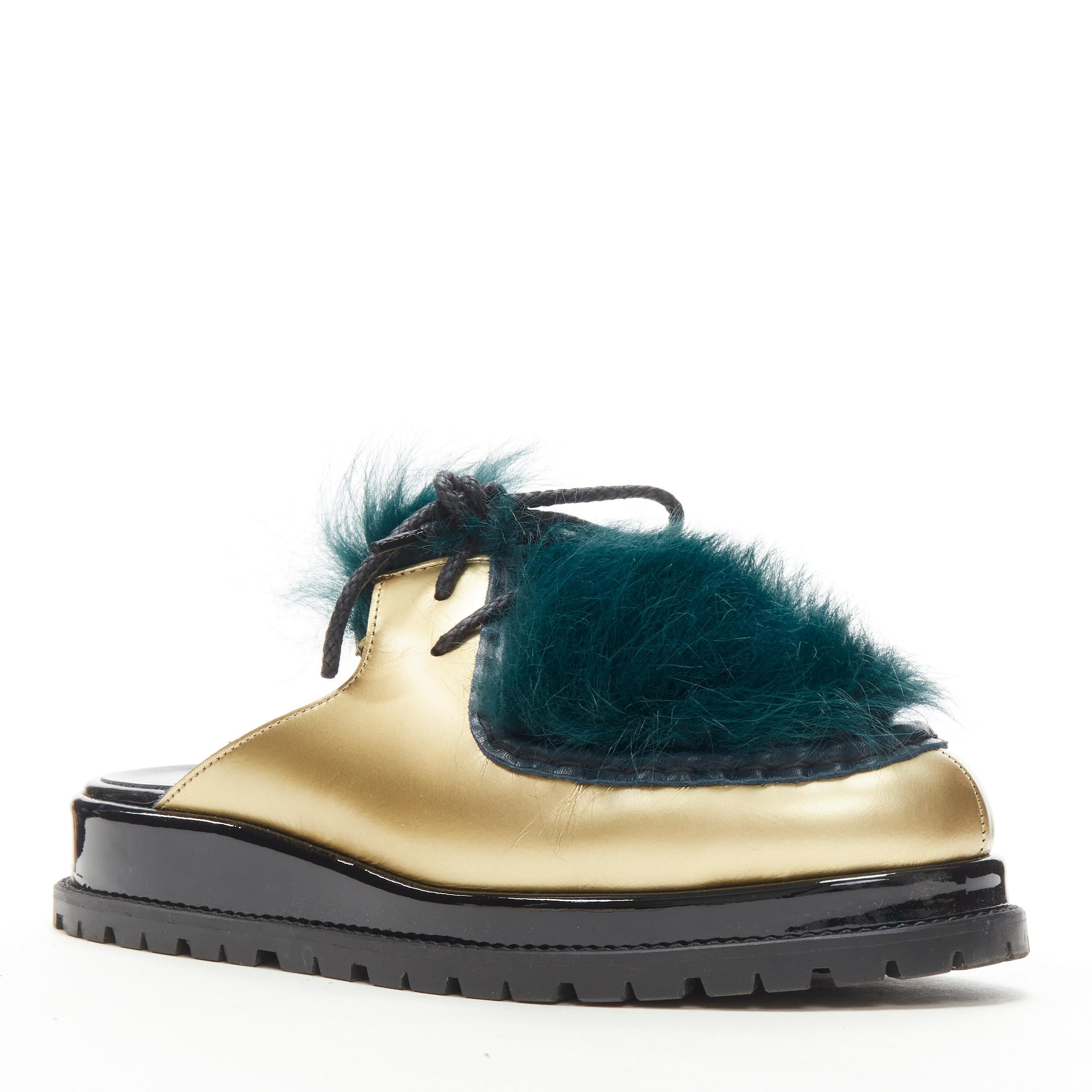 SACAI metallic gold leather teal blue fur slip on mule Vibram sole EU37 
Reference: ANWU/A00325 
Brand: Sacai 
Designer: Chitose Abe 
Collection: 2017 Runway 
Material: Leather 
Color: Gold 
Pattern: Solid 
Closure: Lace 
Made in: Spain 

CONDITION: