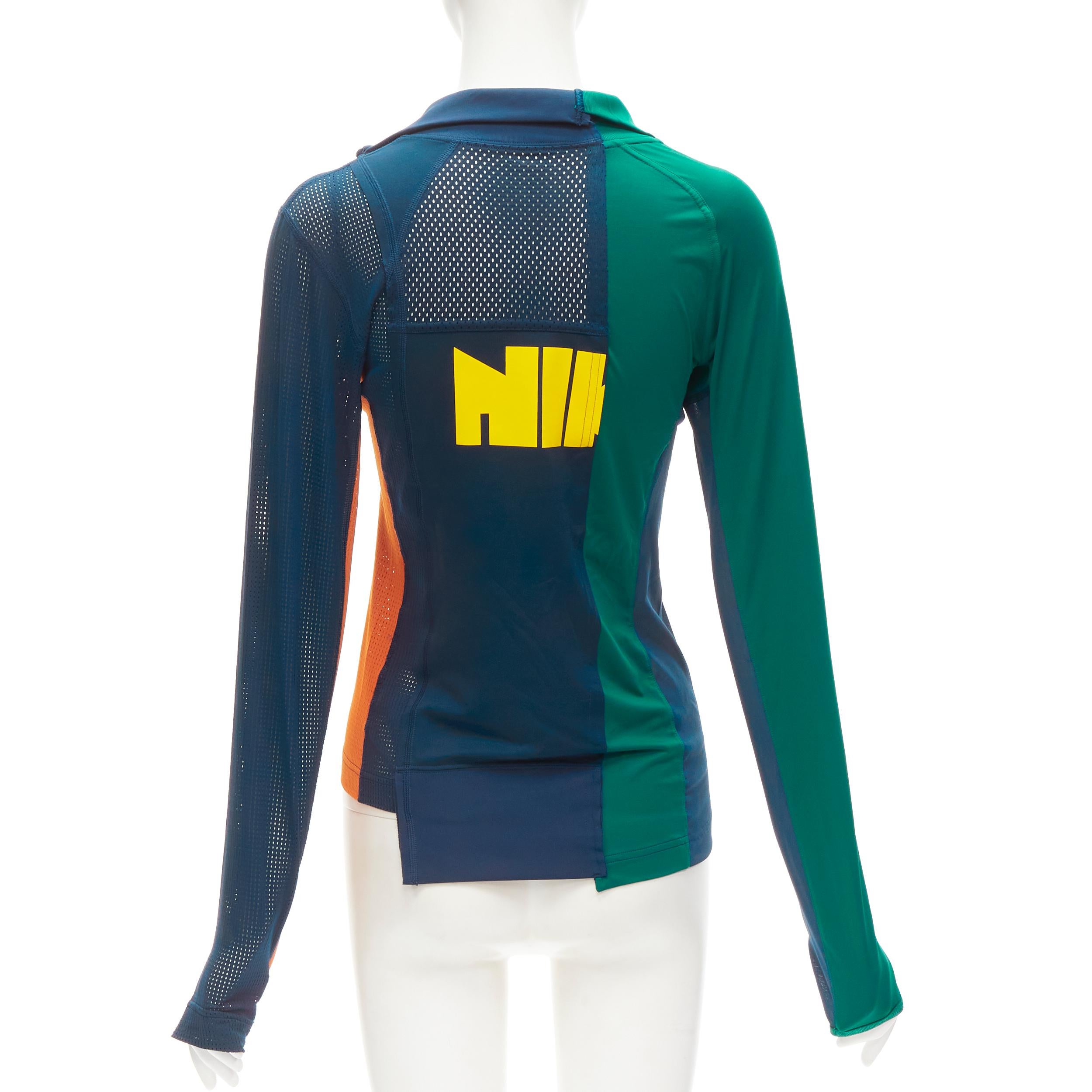 SACAI NIKE Athletics West patchwork football perforated half zip top XXS
Brand: Sacai
Designer: Chitose Abe
Material: Feels like polyester
Color: Blue
Closure: Zip
Extra Detail: Sacai Nike logo on zip pull. Thumbhole at sleeves.
Made in:
