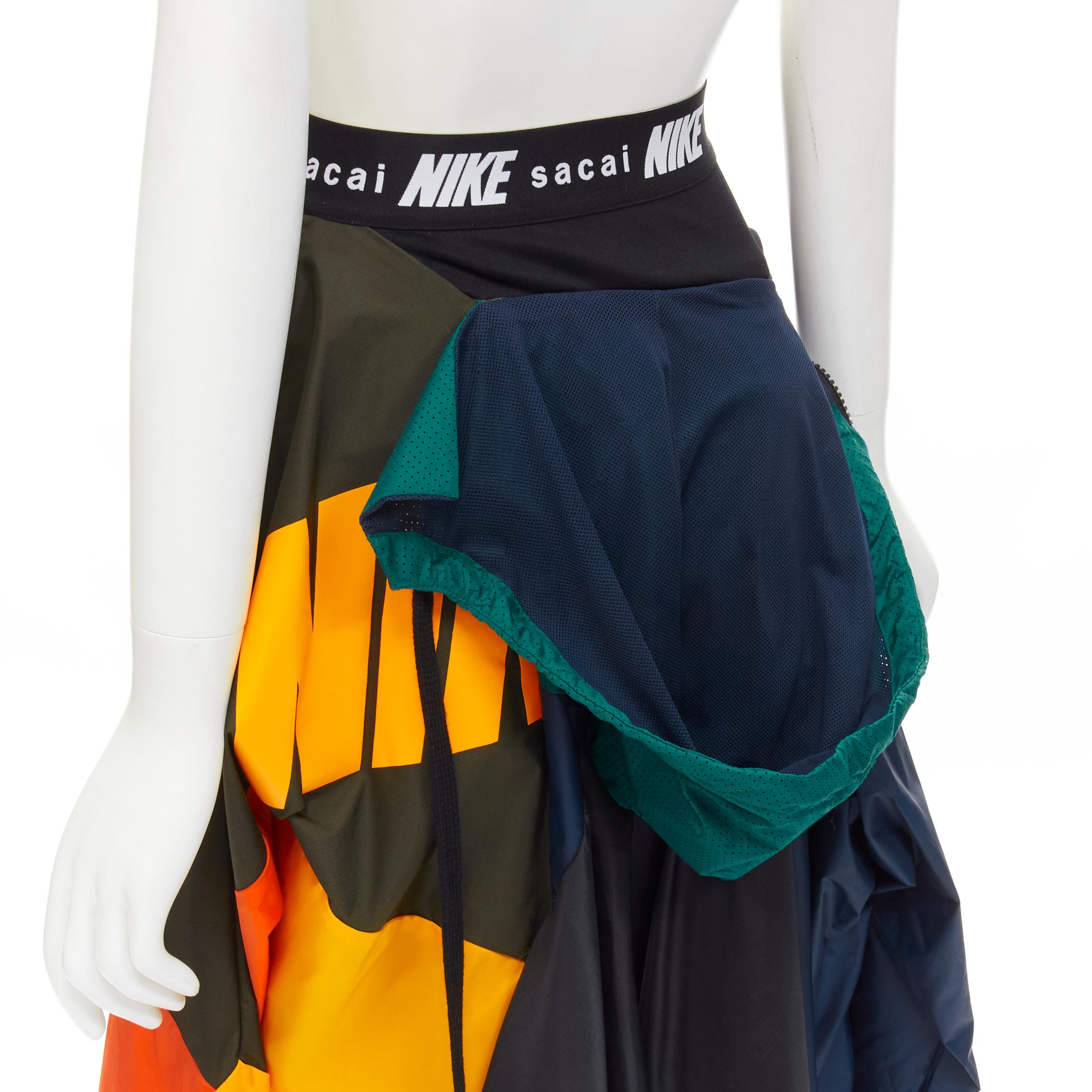 SACAI NIKE deconstructed windbreaker patchwork draped skirt XXS 
Reference: ANWU/A00438 
Brand: Nike 
Designer: Chitose Abe 
Collection: Sacai Collaboration 
Material: Nylon 
Color: Multi 
Pattern: Solid 
Extra Detail: Logo waist band. 
Made in: