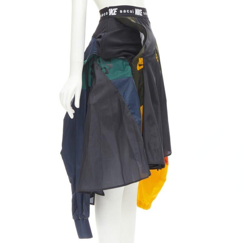 Black SACAI NIKE deconstructed windbreaker patchwork draped skirt XXS For Sale