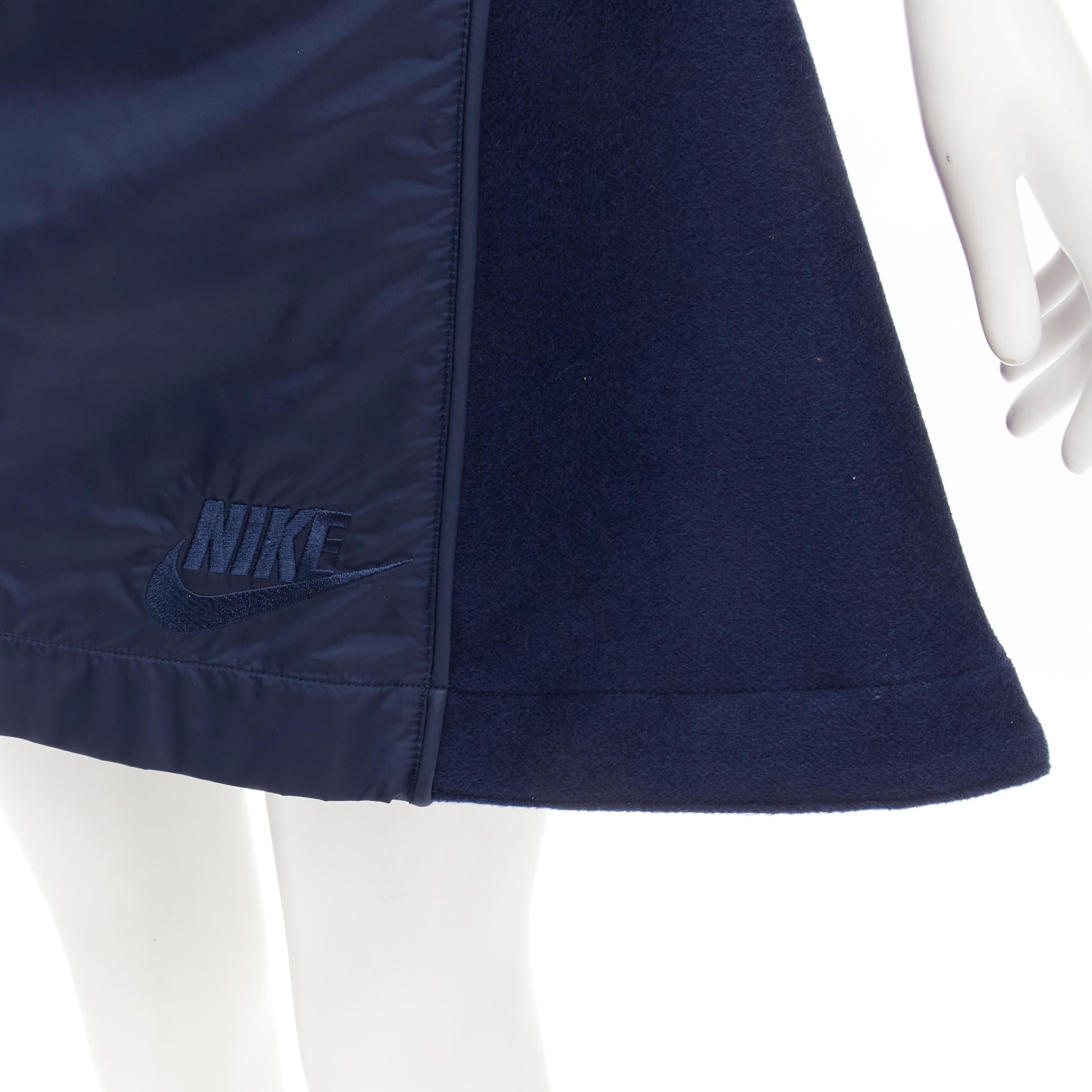 SACAI NIKE navy blue nylon wool kick flared back skirt S 
Reference: ANWU/A00455 
Brand: Nike 
Designer: Chitose Abe 
Collection: Sacai collaboration 
Material: Nylon 
Color: Navy 
Pattern: Solid 
Closure: Drawstring Extra Detail: Double pockets at