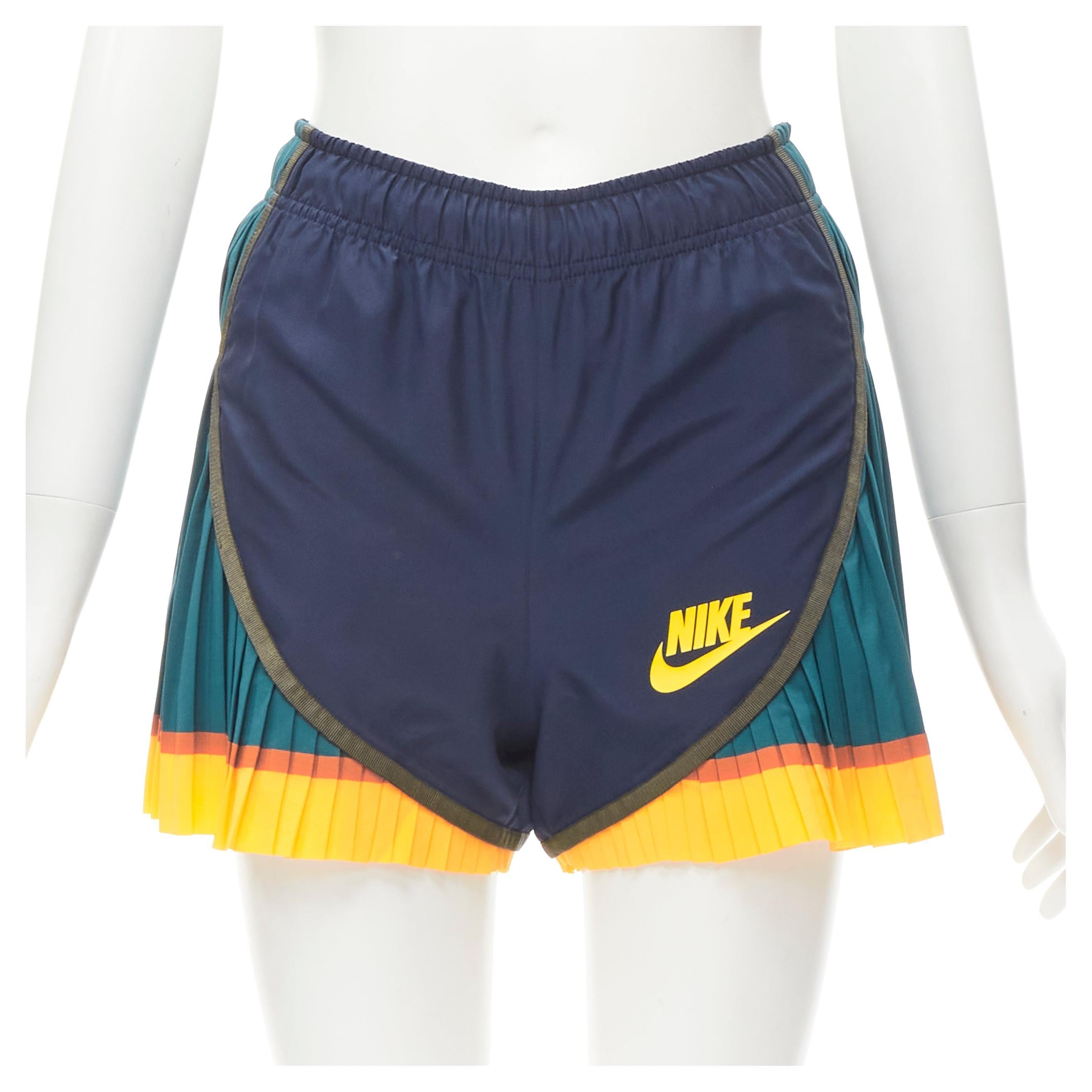 SACAI NIKE navy nylon green yellow pleated hem shorts XS at 1stDibs | nike  sacai pleated shorts, nike sacai shorts