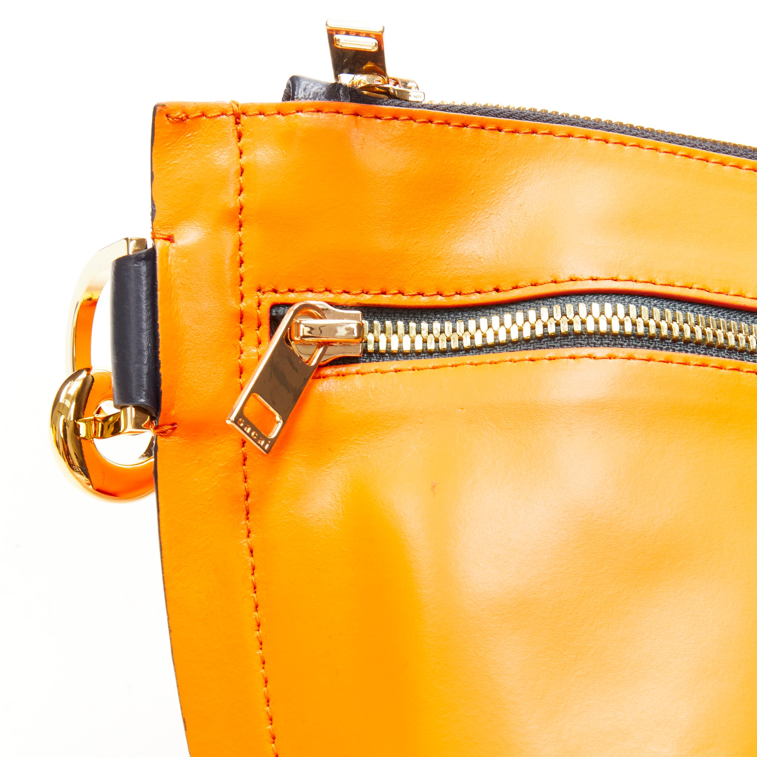 Women's SACAI orange leather navy belt strap gold logo crossbody bag For Sale