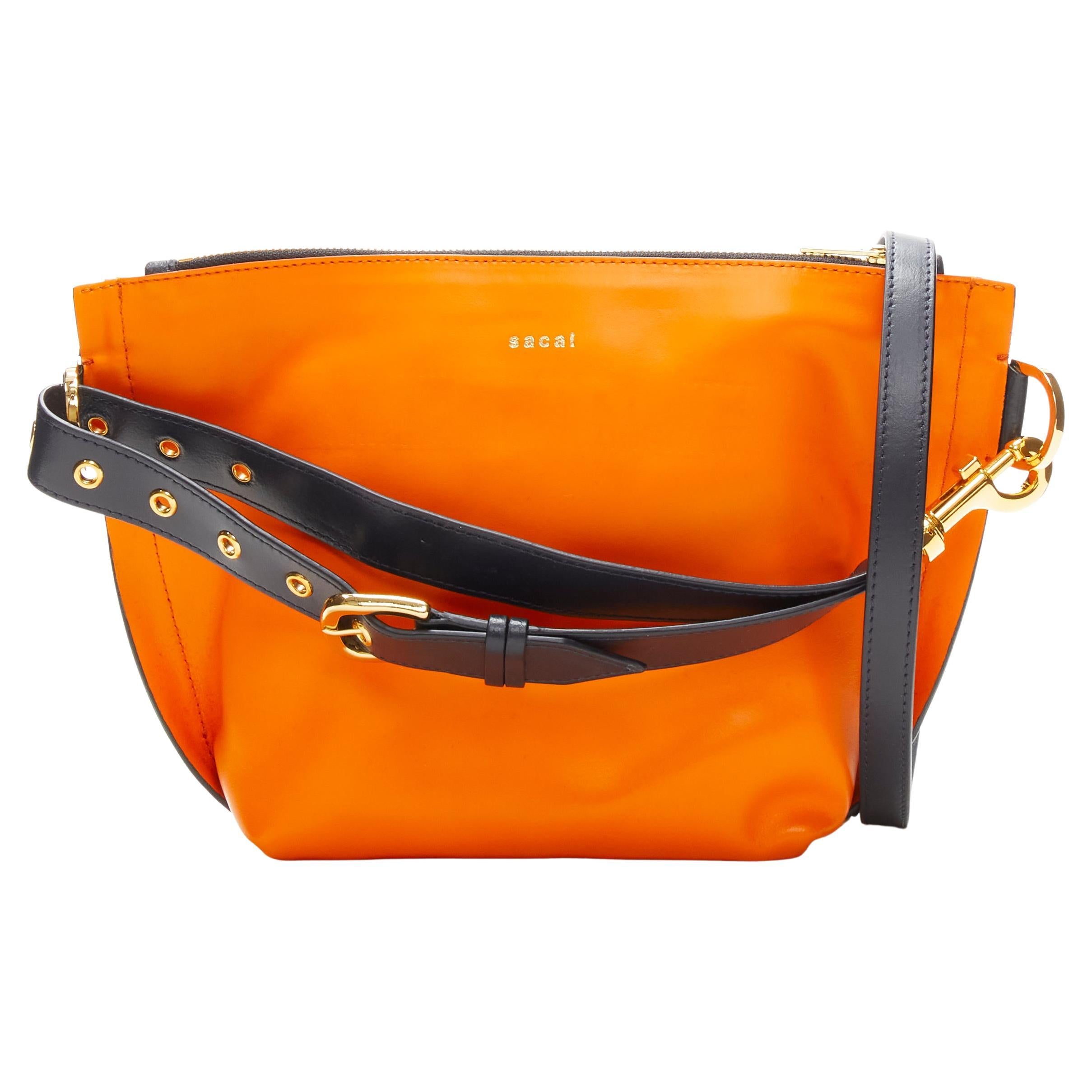 SACAI orange leather navy belt strap gold logo crossbody bag