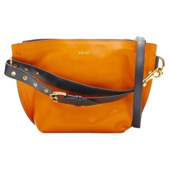 SACAI orange leather navy belt strap gold logo crossbody bag