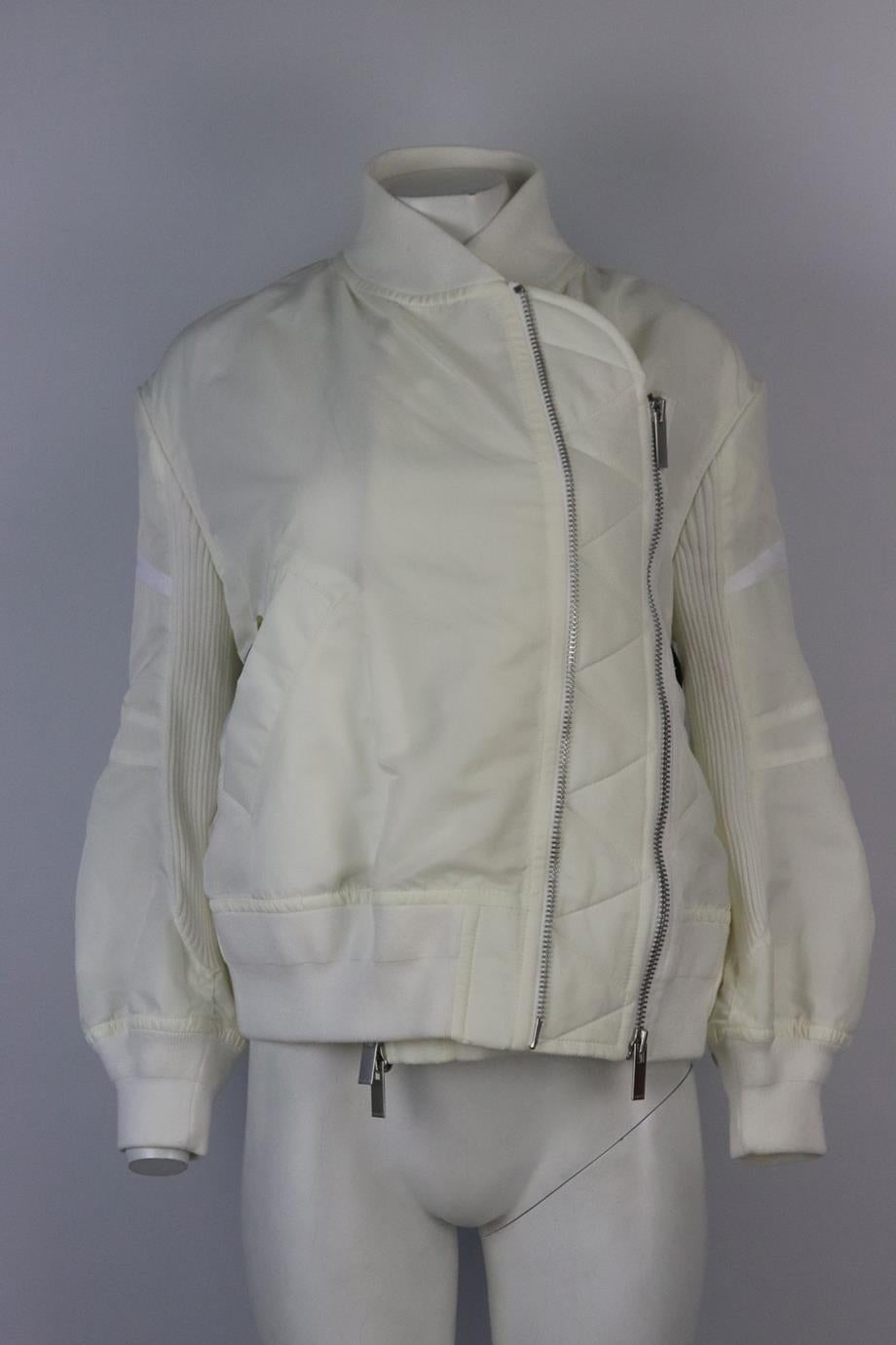 Sacai ruffled shell bomber jacket. White. Long sleeve, crewneck. Zip fastening at front. 100% Nylon; fabric2: 100% cotton; fabric3: 100% polyester; filling: 100% polyeser; lining: 100% cupro. Size: 2 (UK 8, US 4, FR 36, IT 40). Shoulder to shoulder: