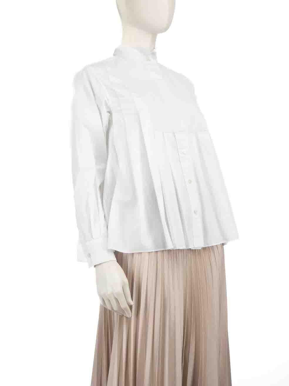 CONDITION is Very good. Minimal wear to the shirt is evident. Minimal wear is seen with some discolouration to the right underarm lining on this used Sacai designer resale item.
 
 
 
 Details
 
 
 White
 
 Polyester
 
 Shirt
 
 Pleated
 
 Long