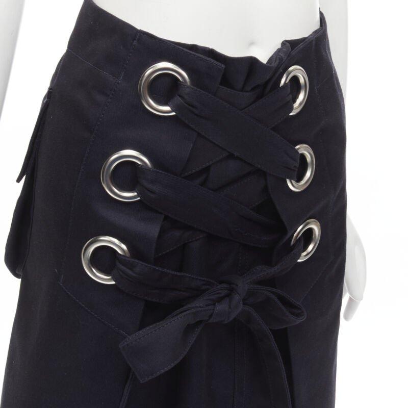 SACAI XL silver grommet lace front A-line skirt S
Reference: ANWU/A00826
Brand: Sacai
Designer: Chitose Abe
Material: Feels like cotton
Color: Navy, Silver
Pattern: Solid
Closure: Zip
Extra Details: Silver grommet detailing. lace front. Side zip