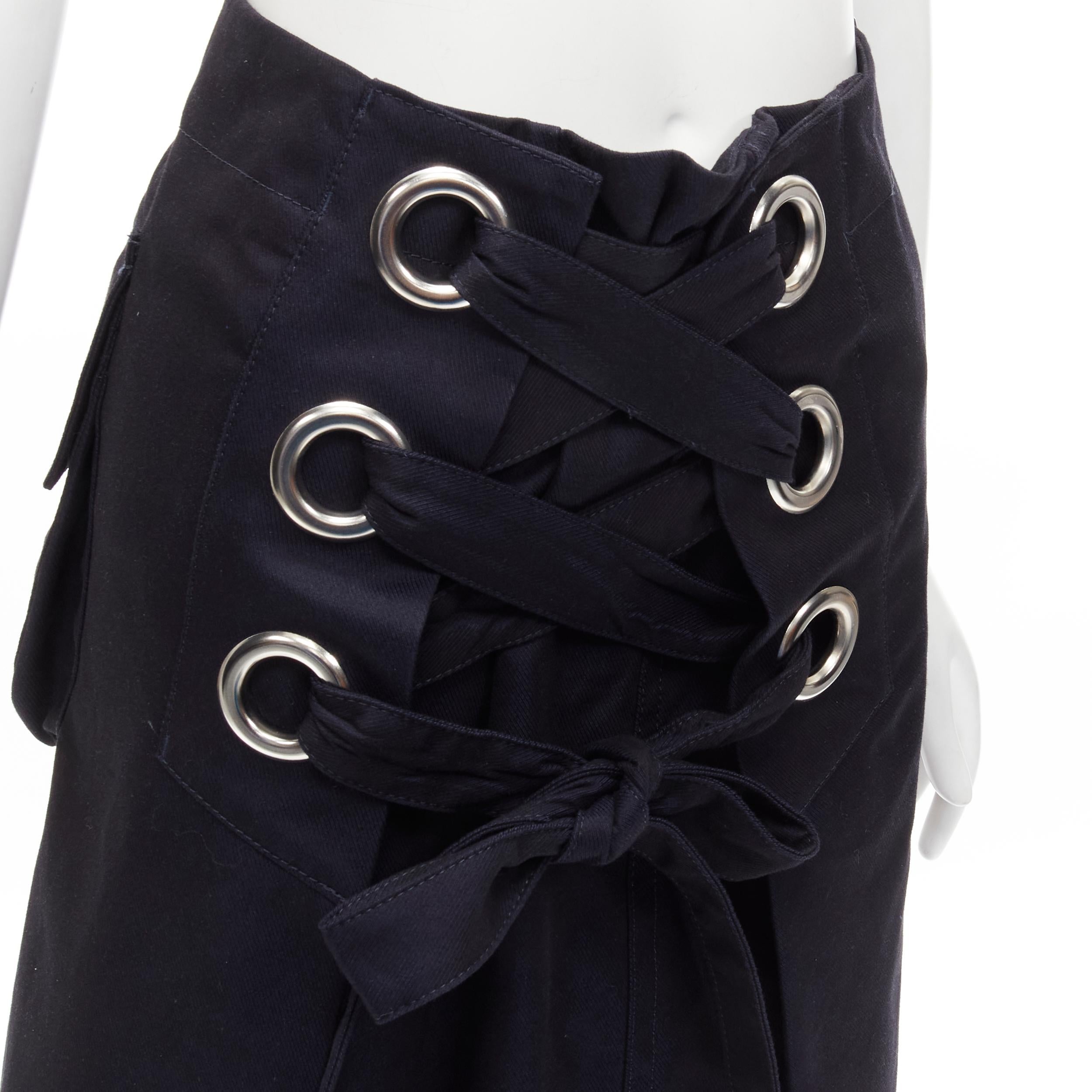 SACAI XL silver grommet lace front A-line skirt S
Brand: Sacai
Designer: Chitose Abe
Material: Feels like cotton
Color: Navy
Pattern: Solid
Closure: Zip
Extra Detail: Silver grommet detailing. lace front. Side zip closure. Snap button back pocket.