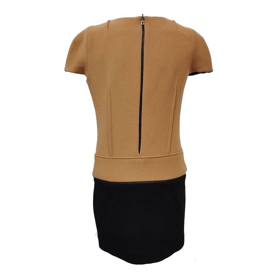 Wool (78%), nylon and elasthane Beige and black color Short sleeve Shoulder/hem length cm 85 (33,4 inches) Shoulder cm 35 (13,77 inches) It can be turned into a top (removing the black skirt)