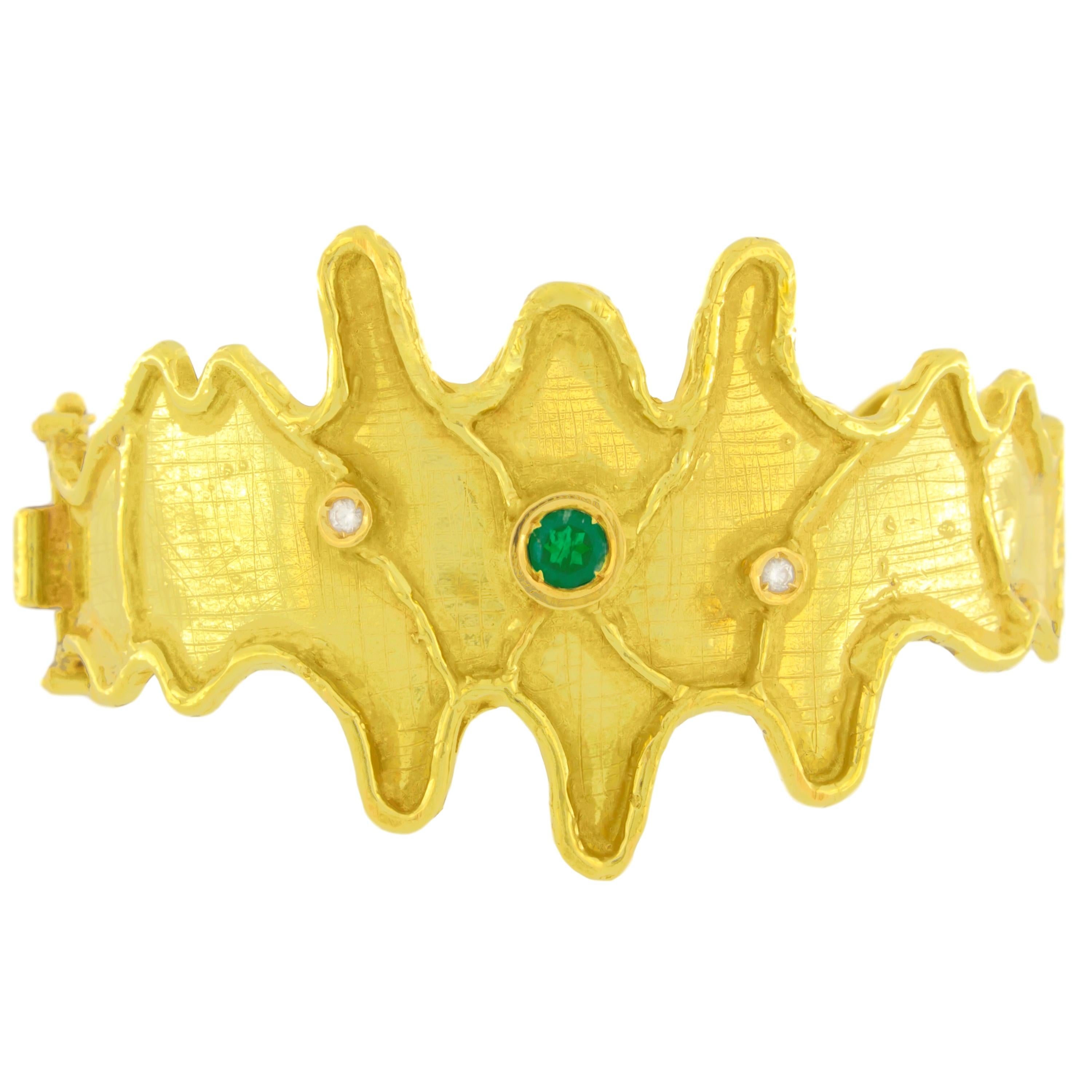 Gorgeous Emerald and Diamonds Satin Yellow Gold Cuff Bracelet, from Sacchi’s “Abstract” Collection, hand-crafted with lost-wax casting technique.

Lost-wax casting, one of the oldest techniques for creating jewelry, forms the basis of Sacchi's