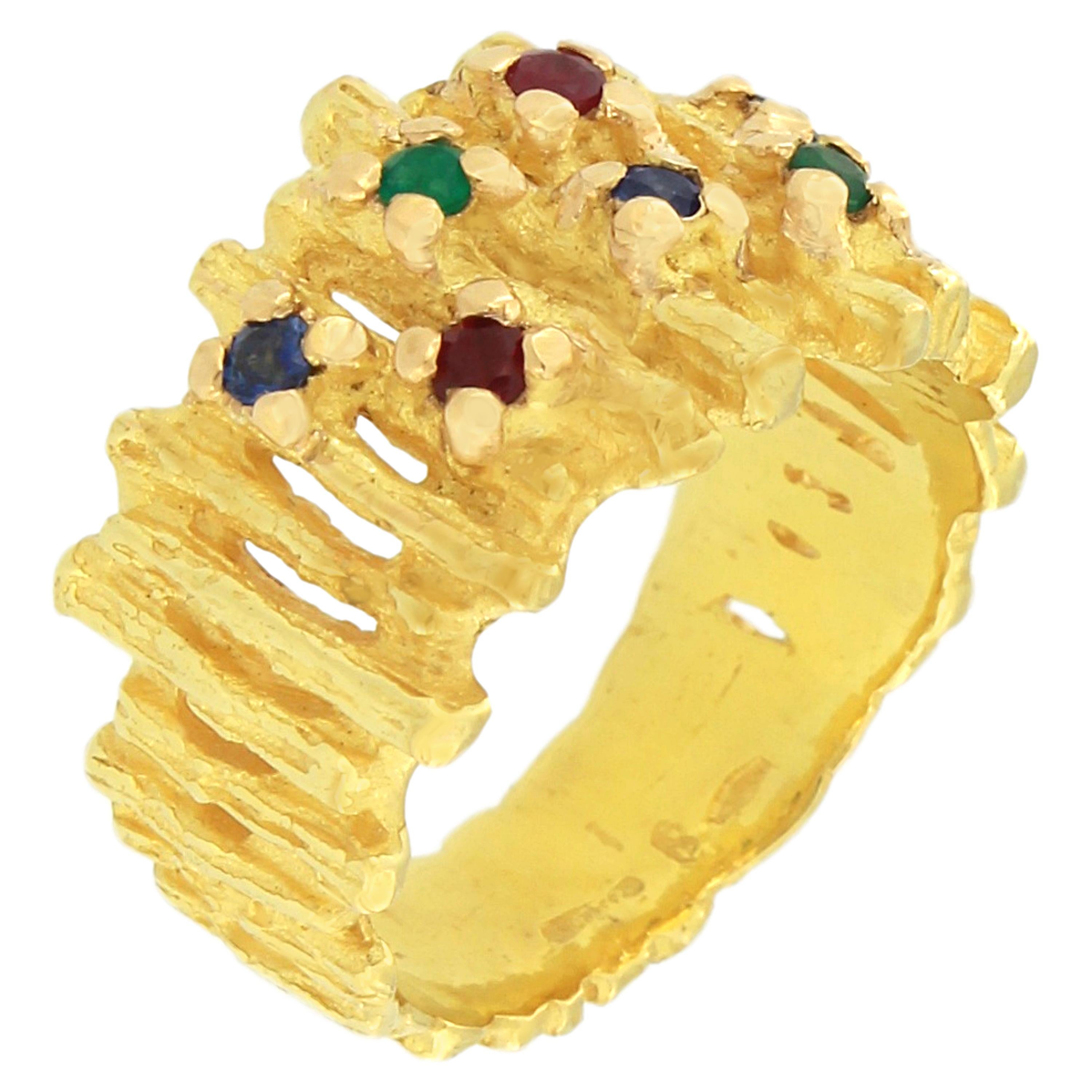 Gorgeous Ruby Emerald and Blu Sapphire gemstone Satin Yellow Gold Cocktail Ring, from Sacchi’s Abstract Collection, hand-crafted with lost-wax casting technique.

Lost-wax casting, one of the oldest techniques for creating jewelry, forms the basis
