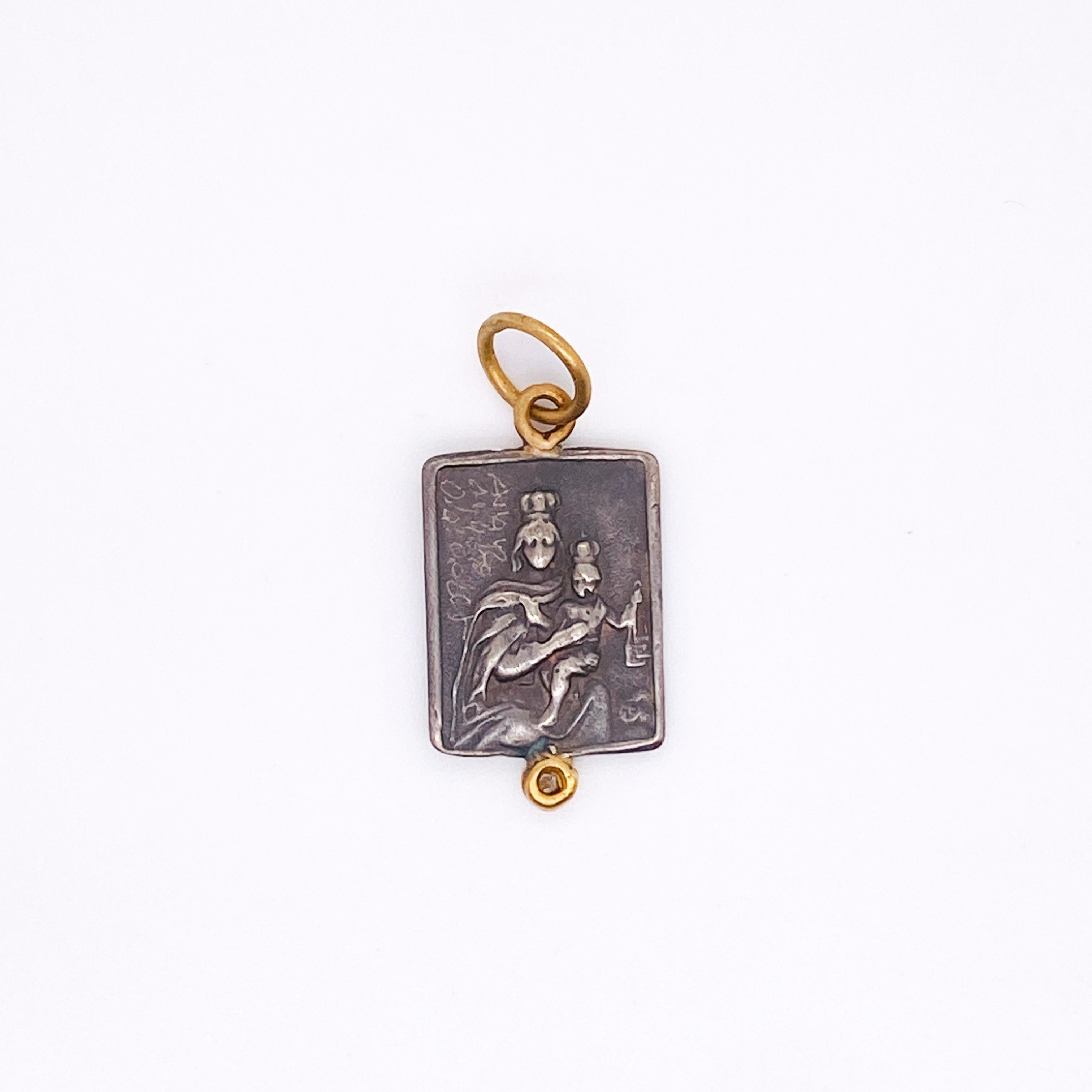 The sacred heart of Jesus and Mary is perfect to show your faith. The Christian pendant has Jesus on one side and Mary on the other. He rectangle shape is very unique and there is a 24 karat double jump ring to go on a chain or a charm bracelet.