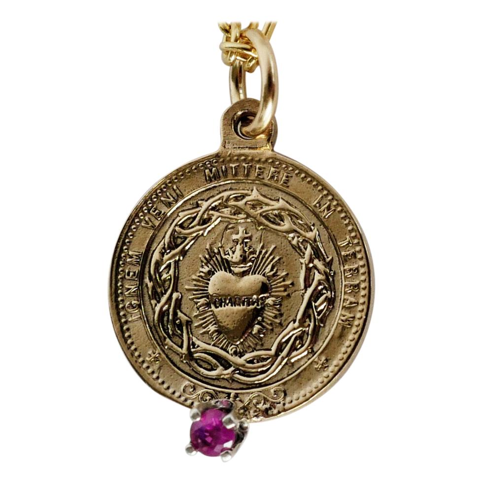 Red Tourmaline Sacred Heart Coin Medal Pendant Gold Filled Chain Necklace

The Sacred Heart (also known as the Sacred Heart of Jesus) has one of the deepest meanings in the Roman Catholic practice. The symbol represents Jesus Christ’s actual heart