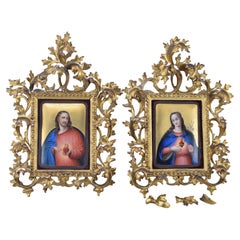 Antique Sacred Hearts of Jesus and Mary. Enamel, wood. Spanish school, 19th century.