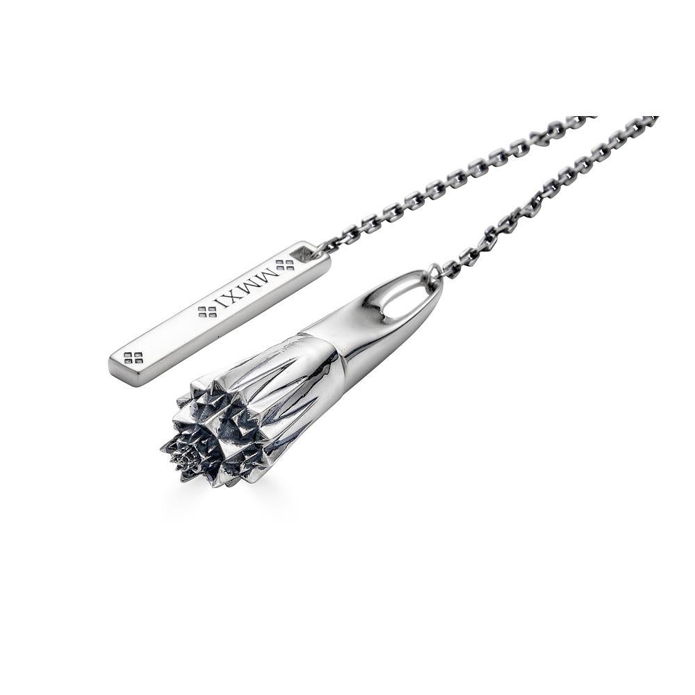 The Sacred Medicine Silver Necklace hides a spoon hidden inside a screw-top compartment. The necklace is part of the Thoscene collection. The collection is inspired by fractals found in ancient art and architecture, including ruins of the