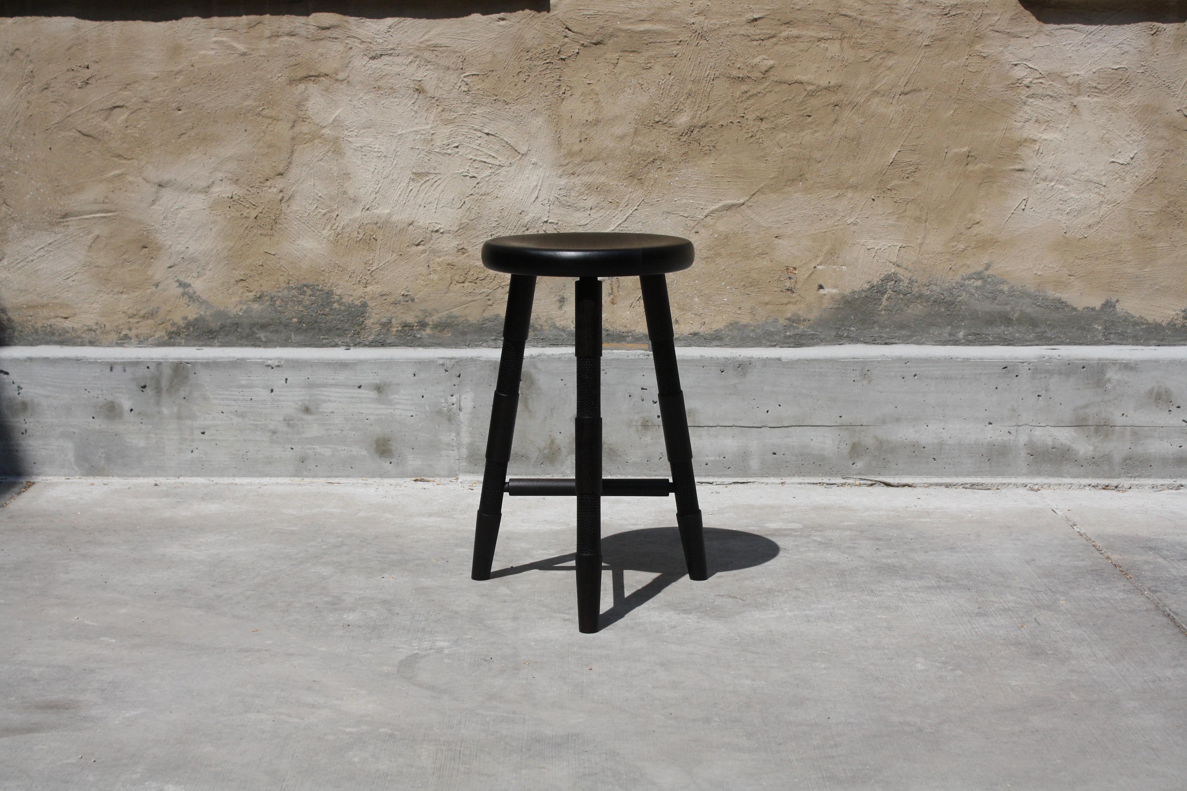 Saddle Counter Stool by Laylo Studio
Dimensions: D 45.7 x H 66 cm.
Materials: Ebonized walnut.

LAYLO is the practice of Sam and Lydia Link. 
Founded with the intention of building through the exploration and integration of traditionally siloed