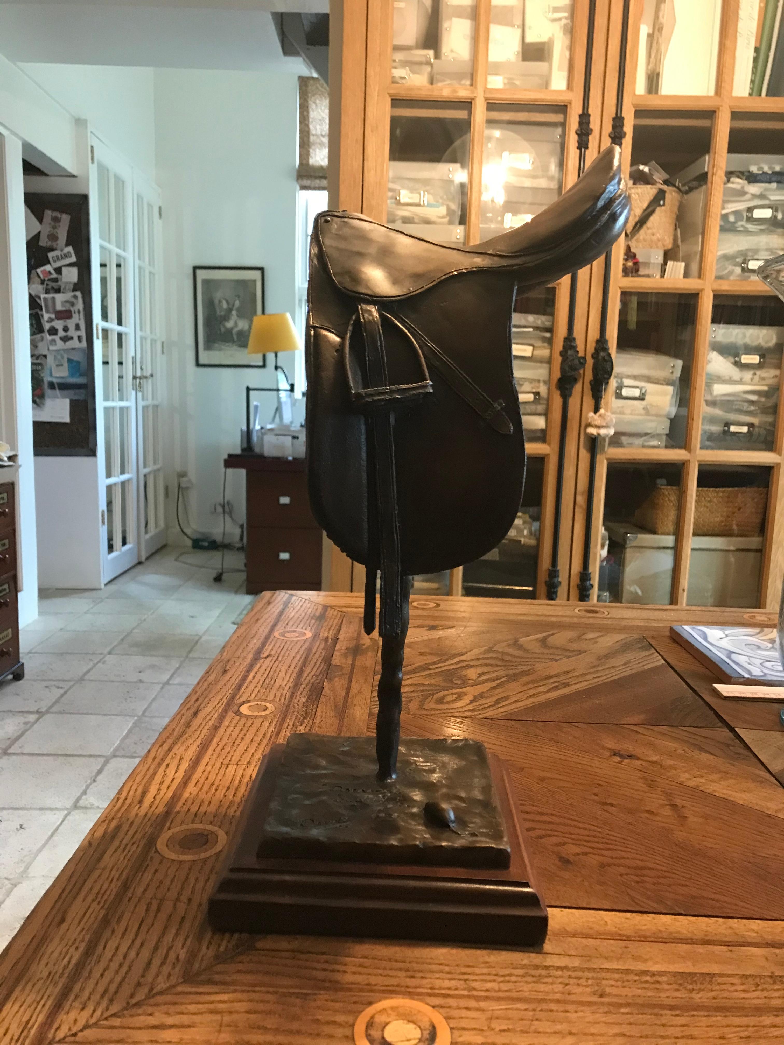 Bronze dressage saddle, with accurate and splendid equestrian details by well noted artist Douwe Blumberg.